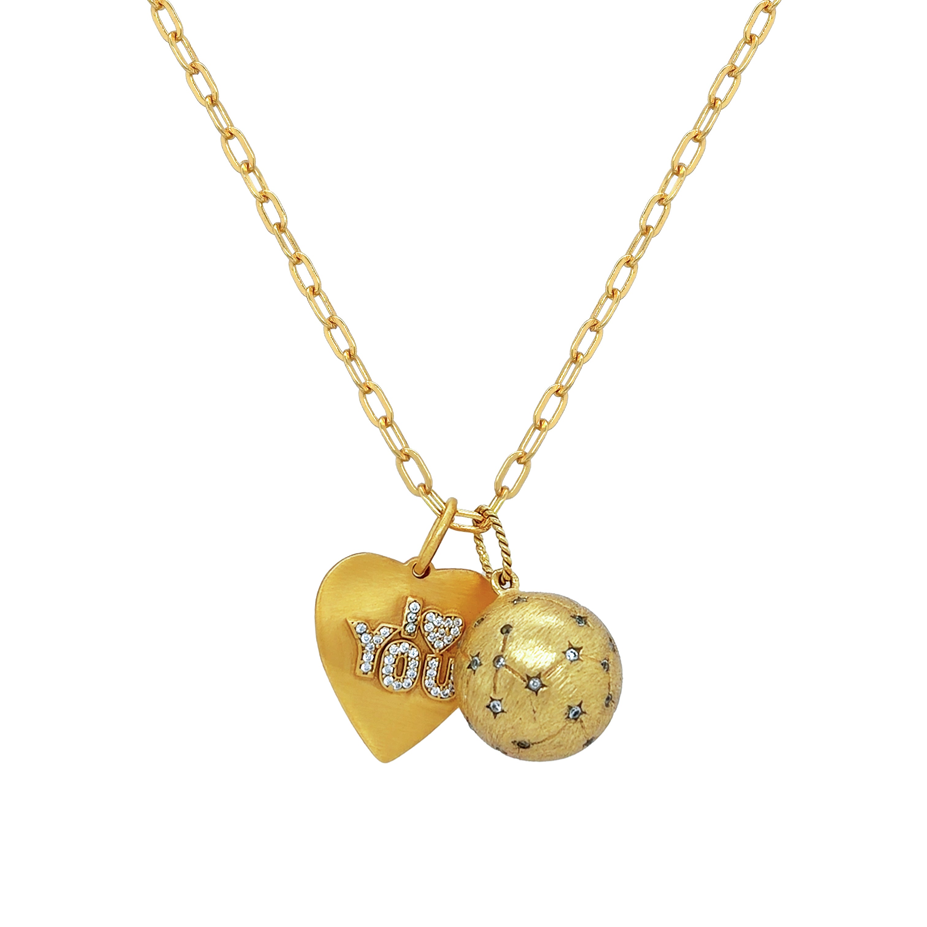 Gold necklace with heart-shaped pendant and spherical ball pendant on a white background