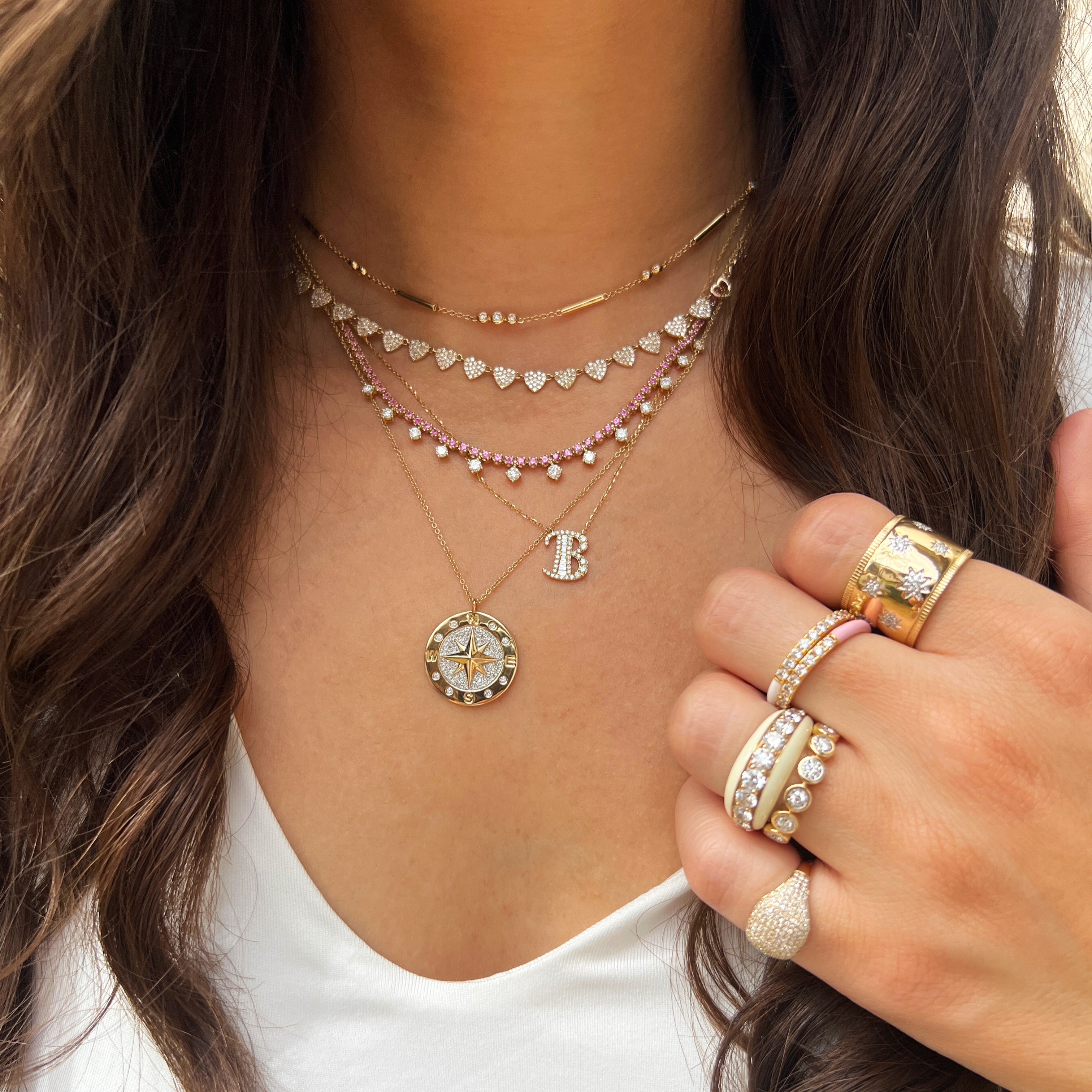 Yellow Gold Pave Diamond Heart Necklace
Bring a touch of elegance and love to your everyday style with our Multi Heart Necklace. Crafted in yellow gold, this necklace features a stunning pave diamond heart design with multiple hearts, making it the perfect accessory for any occasion. Show your love in style and make a statement with this beautiful piece.
14K Yellow Gold
0.87 Diamond Carat Weight
Hearts: 0.20” Diameter
Chain: 15-17” Length