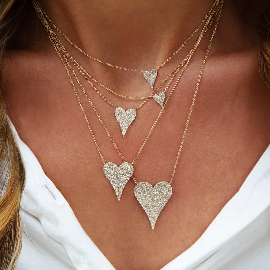 Extra Large Pave Diamond Heart Necklace
Sparkle up your style with our Extra Large Diamond Heart Necklace! This staple piece features shimmering diamonds on a classic heart pendant, perfect for adding a touch of elegance to any outfit. A must-have for any jewelry collection!
14K White Gold
1.07" Length X 0.78" Width
15.5-17.5" Adjustable Length
0.80 Carat Weight
Shop all sizes & colors of this necklace here.