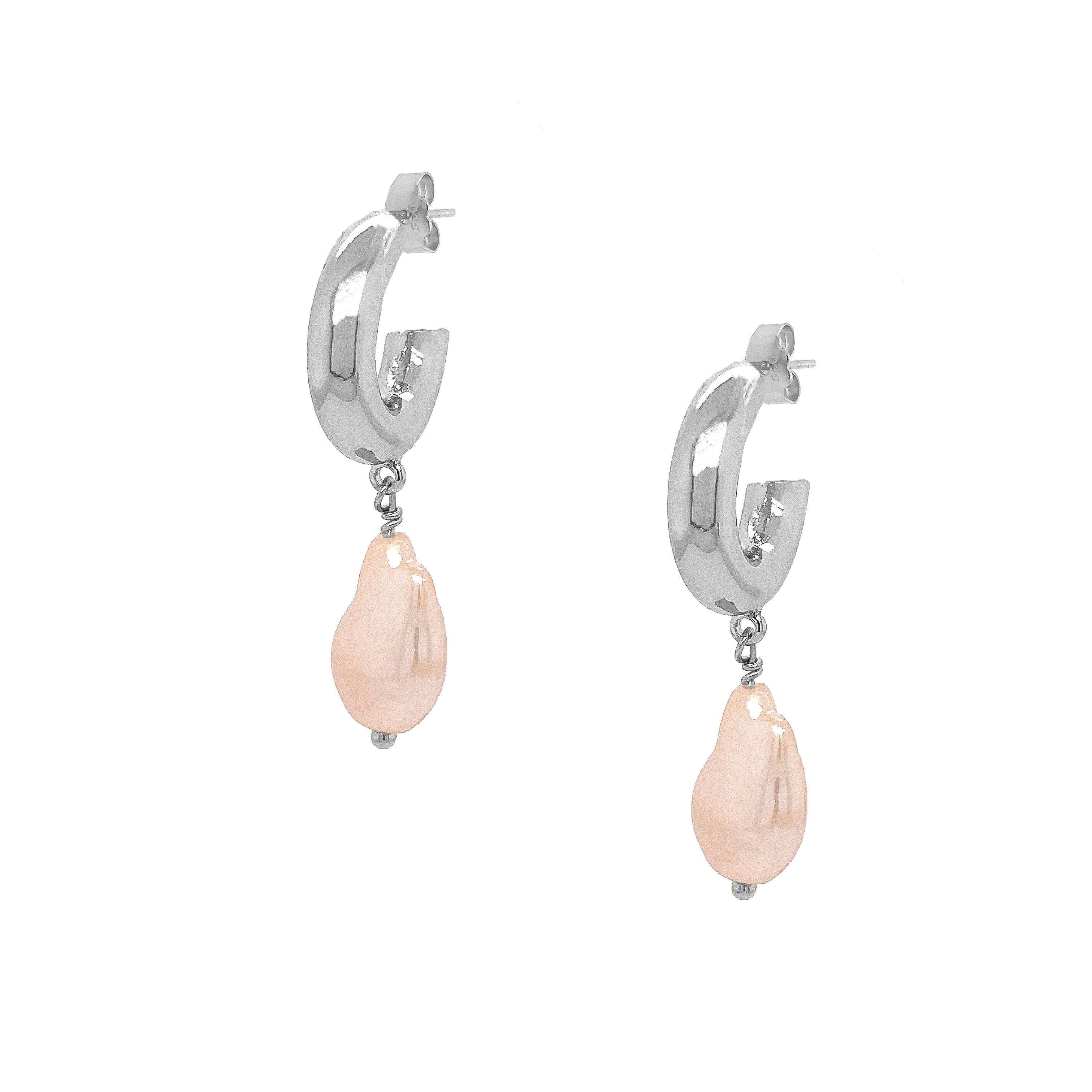 These exquisite hoops feature a stunning light pink pearl elegantly set in your choice of yellow or white gold plating, embodying the essence of elegance and hope. These gorgeous earrings perfectly complement any ensemble, making them a versatile addition to your jewelry collection. Pair them effortlessly with other jewels and stay in vogue while making a meaningful impact. Pink Pearl Drop on Small Hoop Pieced Earrings Yellow or White Gold Plating Faux Light Pink Pearl 1.75" Long X 0.42" Wide