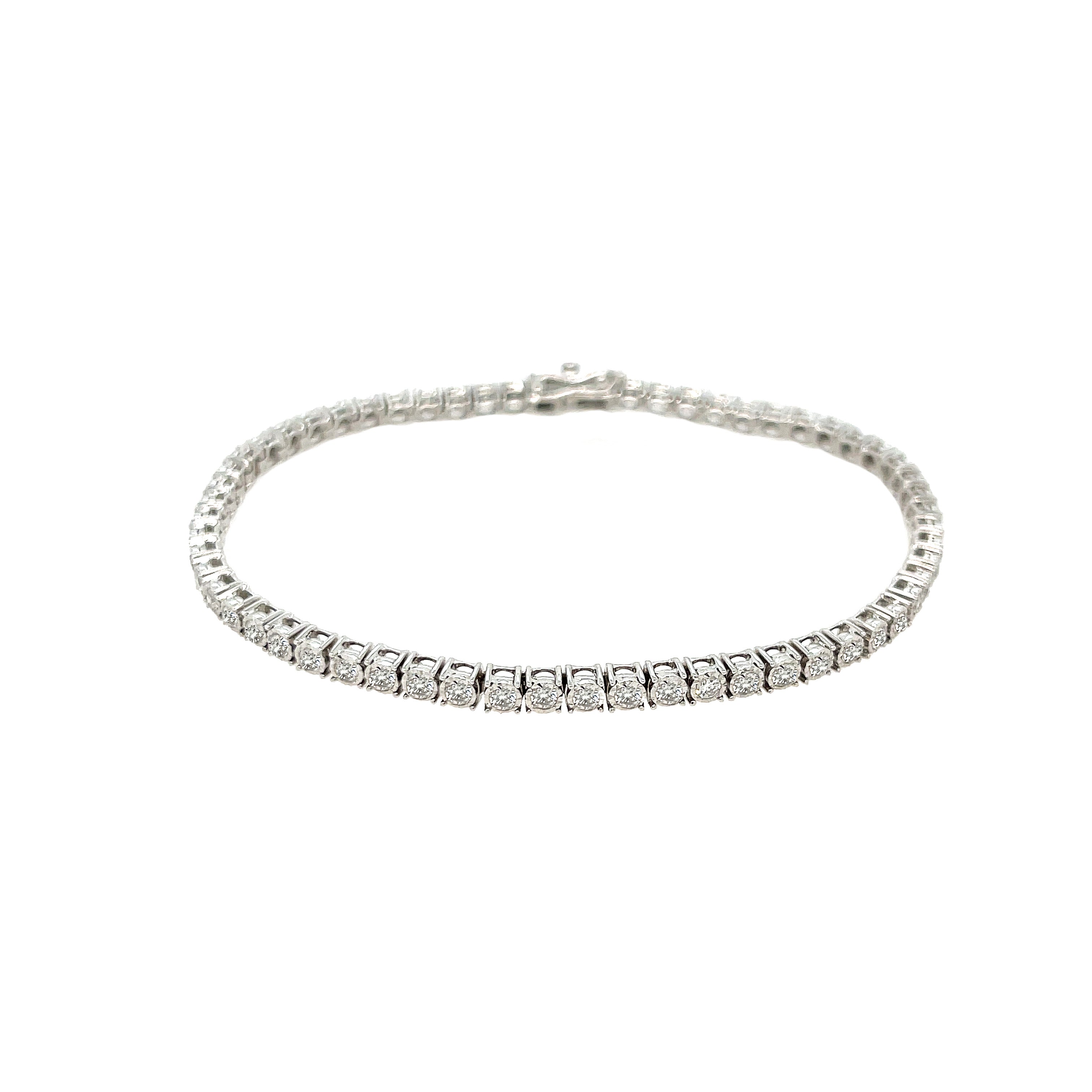 Diamond Tennis Bracelet
Indulge in the timeless elegance of our Diamond Tennis Bracelet. Crafted with sparkling diamonds, this versatile piece is the perfect staple for any outfit. Elevate your style with this luxurious addition to your jewelry collection.
14K White Gold
2 Carat Diamond Weight
7" Length