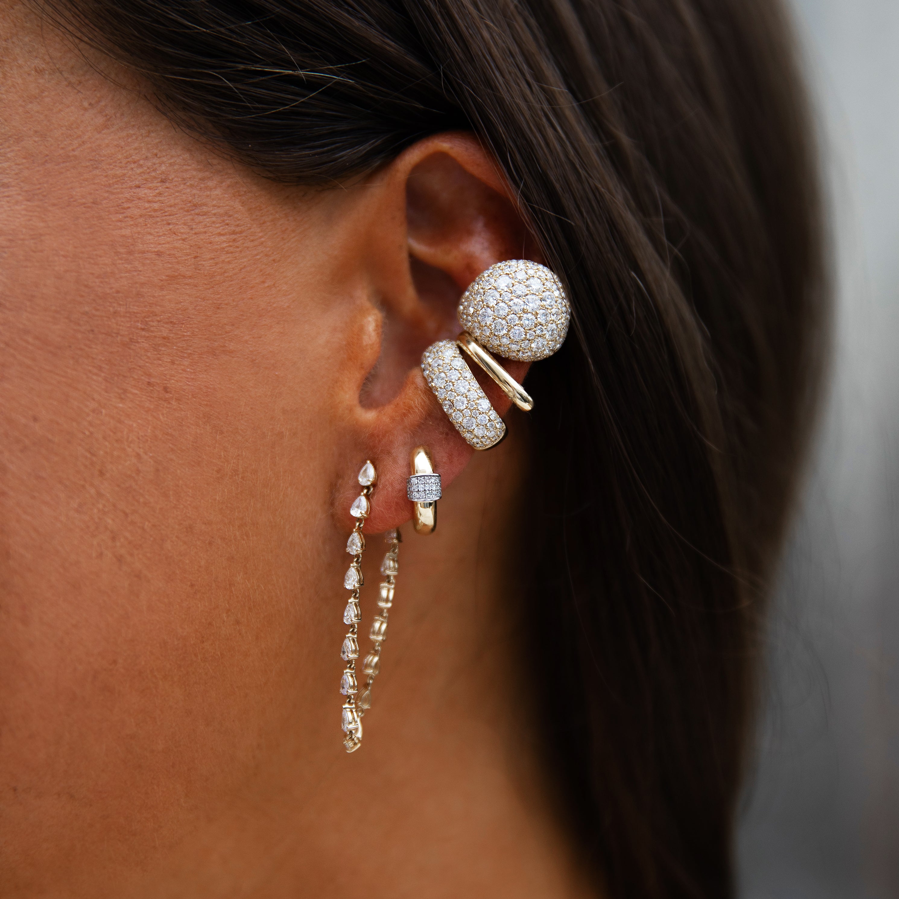 Pave Puff Diamond Ear Cuff
This Diamond Ear Cuff features a unique bubble design accentuated by sparkling diamonds, offering a distinctive and elegant look without the need for piercings.
18K Yellow Gold
0.64" Long X 0.58" Wide
2.88 Diamond Carat Weight