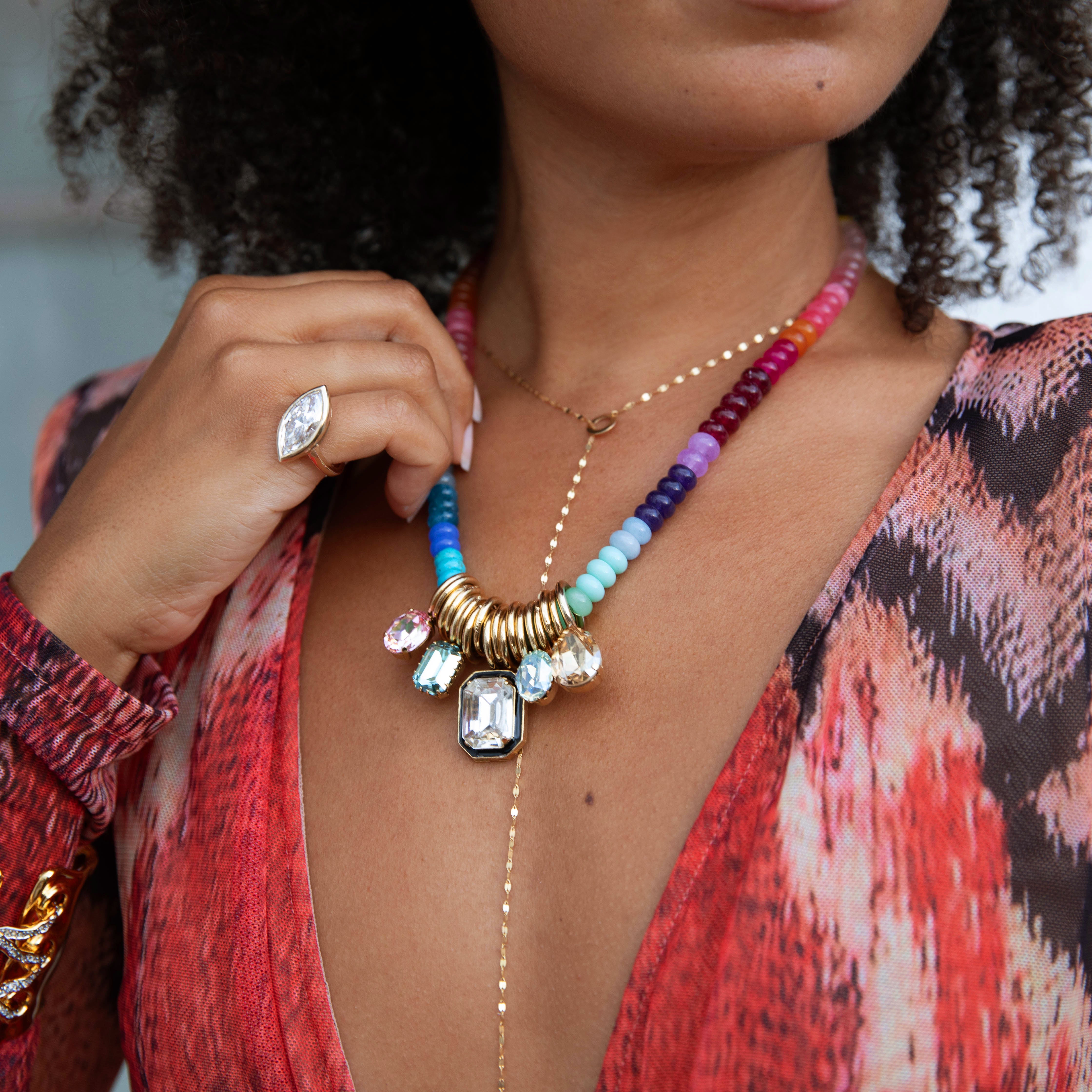Multi Charm Rainbow Beaded Necklace
A chic and elevated statement necklace designed to layer effortlessly with your everyday favorites. Crafted with yellow-gold plating, this piece features multi-colored cubic zirconia, offering polished sparkle without the fine-jewelry price.
Due to popular demand, please allow 4-6 week for delivery.
Yellow Gold Plated
Multi-colored Cubic Zirconia Stones
17-20" Adjustable Length