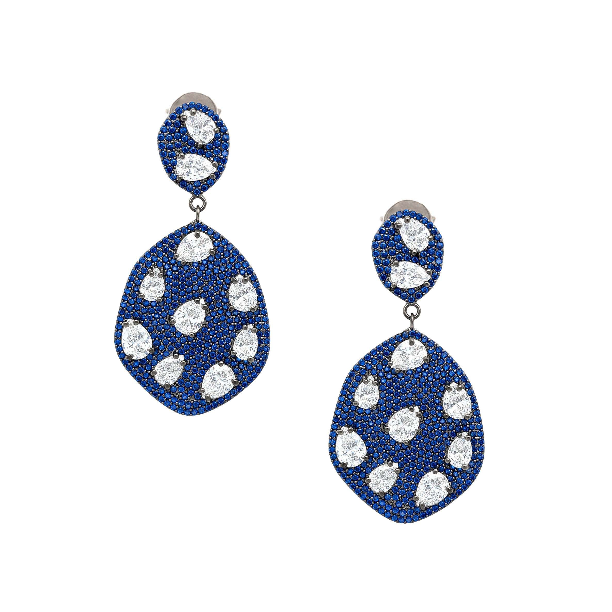 Blue & White Galaxy Pierced Earrings
Turn up the sparkle with the Blue & White Galaxy Earrings. Vibrant blue cubic zirconia stones float across a dazzling pave setting, creating a celestial-inspired look that's bold, glamorous, and unforgettable. Style with an evening look or let them be the star of your everyday outfit.
Oxidized Gold Plated Over Silver
2" Long X 1.05" Wide
Cubic Zirconia