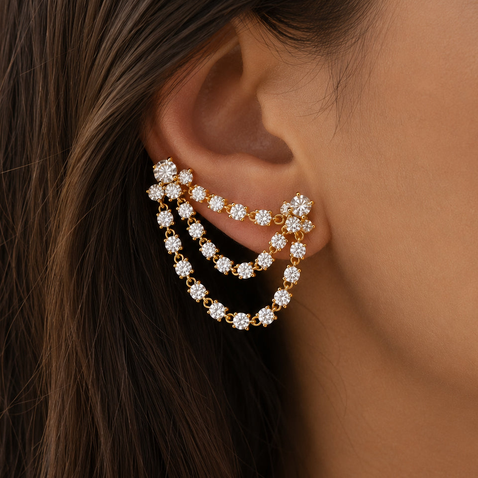 Double Cascade Earring
Sparkling crystals and graceful movement come together in the Double Cascade Earring, a modern statement piece designed to bring effortless elegance to every occasion. Wear it solo for maximum impact or pair it with delicate studs for a curated ear look.
Yellow Gold Plated
Half Pair Earring Only
The drop: 1.25" Long 1.5" Wide
Cubic Zirconia