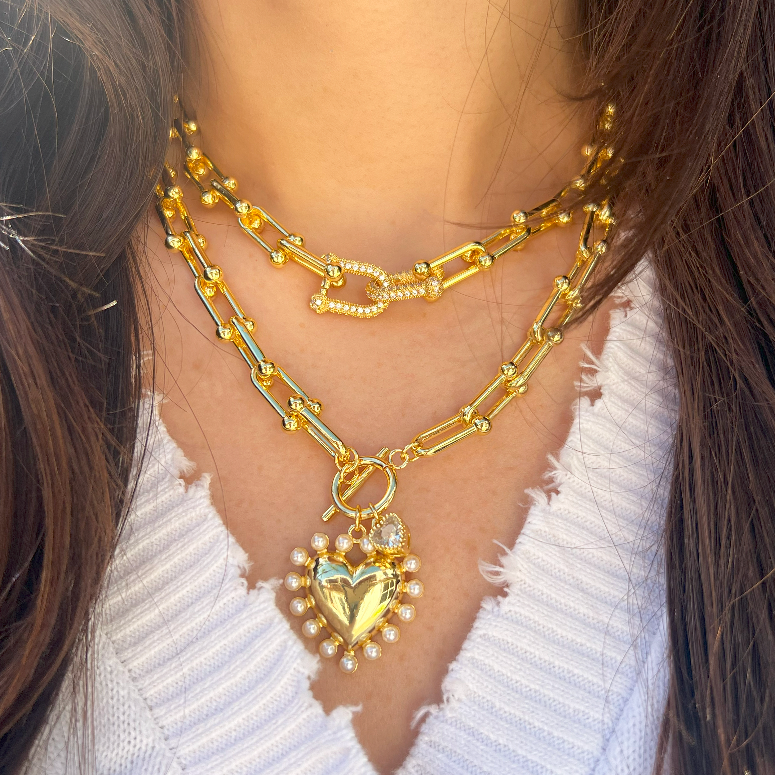 Pearl and CZ Heart Charm Toggle Link Necklace
Yellow Gold Plated
Pearl Charm: 1" Wide
CZ Charm: 0.27" WIde
17" Long
While supplies last. All Deals Of The Day sales are FINAL SALE.