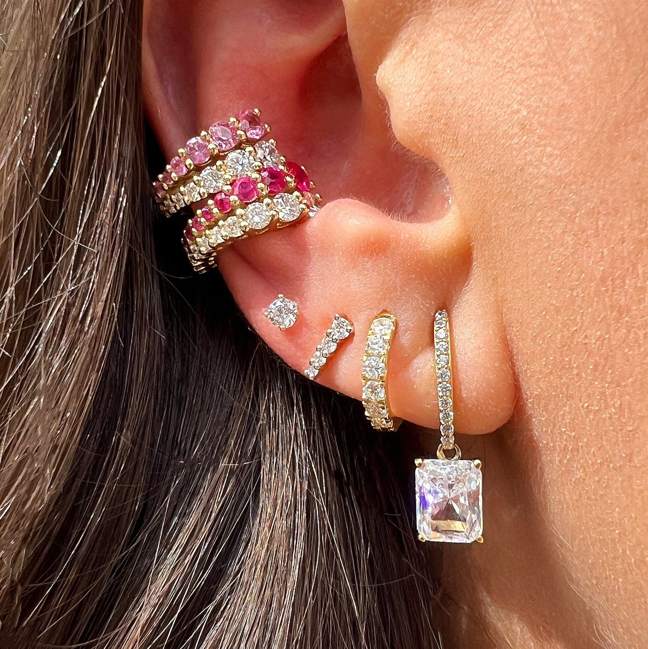 Emerald Cut CZ Drop Clip-On Earrings
These Emerald Cut Clip On Earrings combine the timeless charm of huggie-style hoops with sparkling accents that catch the light beautifully. Designed for comfort and ease, their clip-on mechanism ensures a secure fit without requiring pierced ears. Perfect for adding a refined sparkle to any ensemble, they offer a sophisticated touch for both day and evening wear.
Yellow Gold Plated Over Silver
0.87" Long X 0.25" Wide