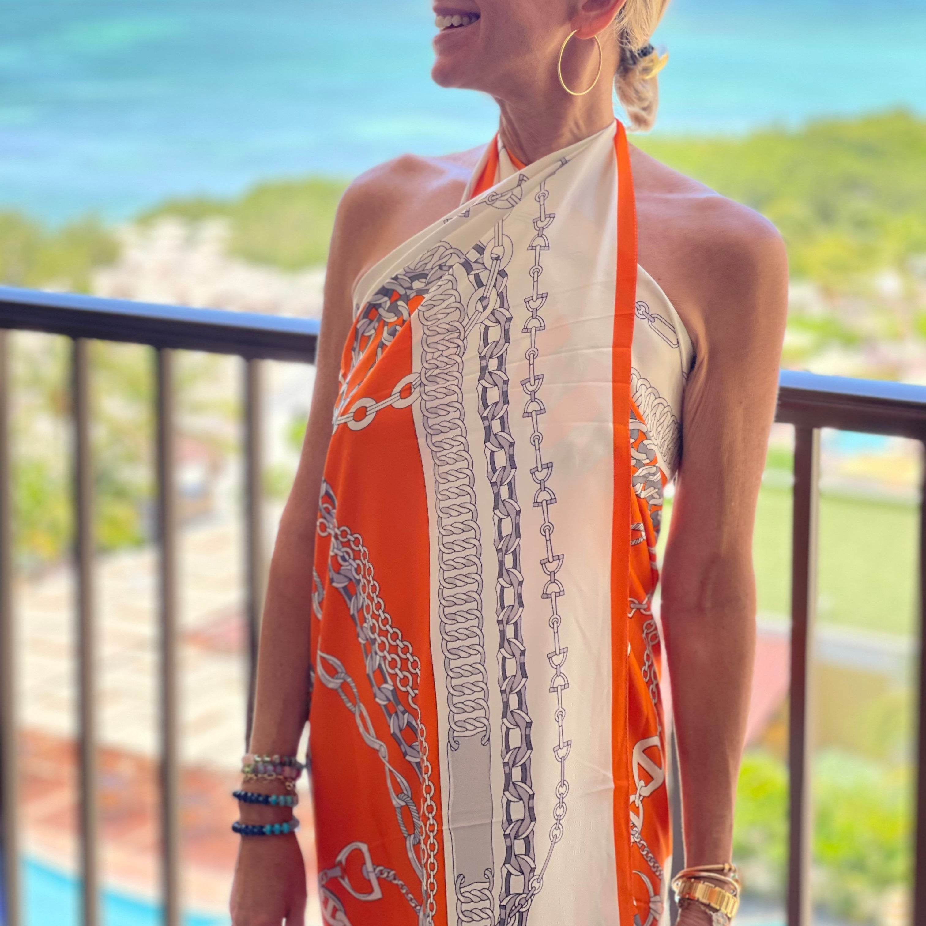 Orange & White Print Scarf
This patterned scarf offers versatile styling—wear it as a shirt, dress, or scarf to create unique, bold looks with ease.
51" x 51" Wide
100% Polyester