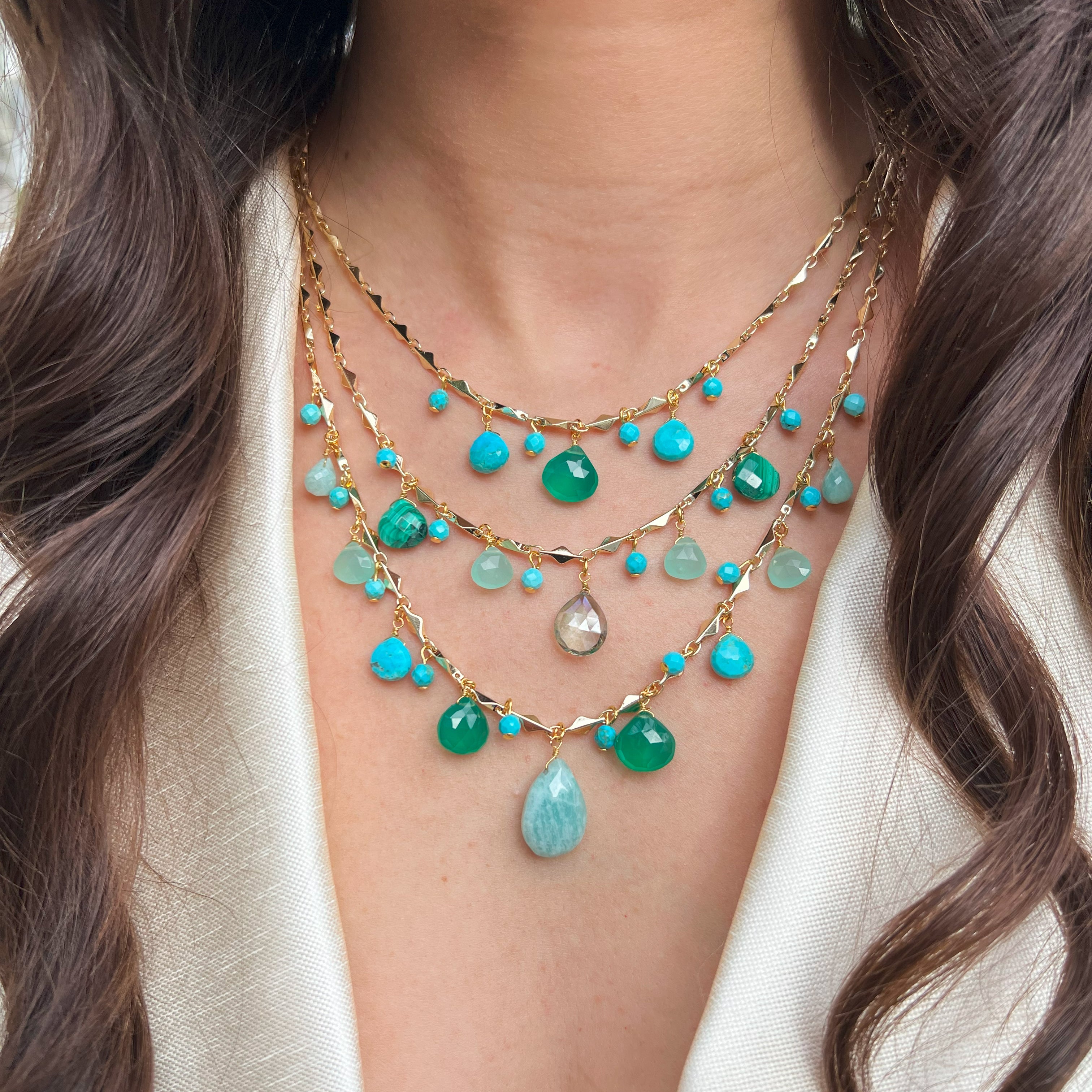 Malachite, Chalcedony & Turquoise Multi Stone 3 Strand Necklace
Add a bold, vibrant touch to your look with our Blue Multi Stone Necklace. Perfect for making a statement and adding a pop of color to any outfit, this necklace will elevate your style game. Don't be afraid to stand out with this playful and eye-catching piece.
Yellow Gold Plated
16-18" Adjustable Length