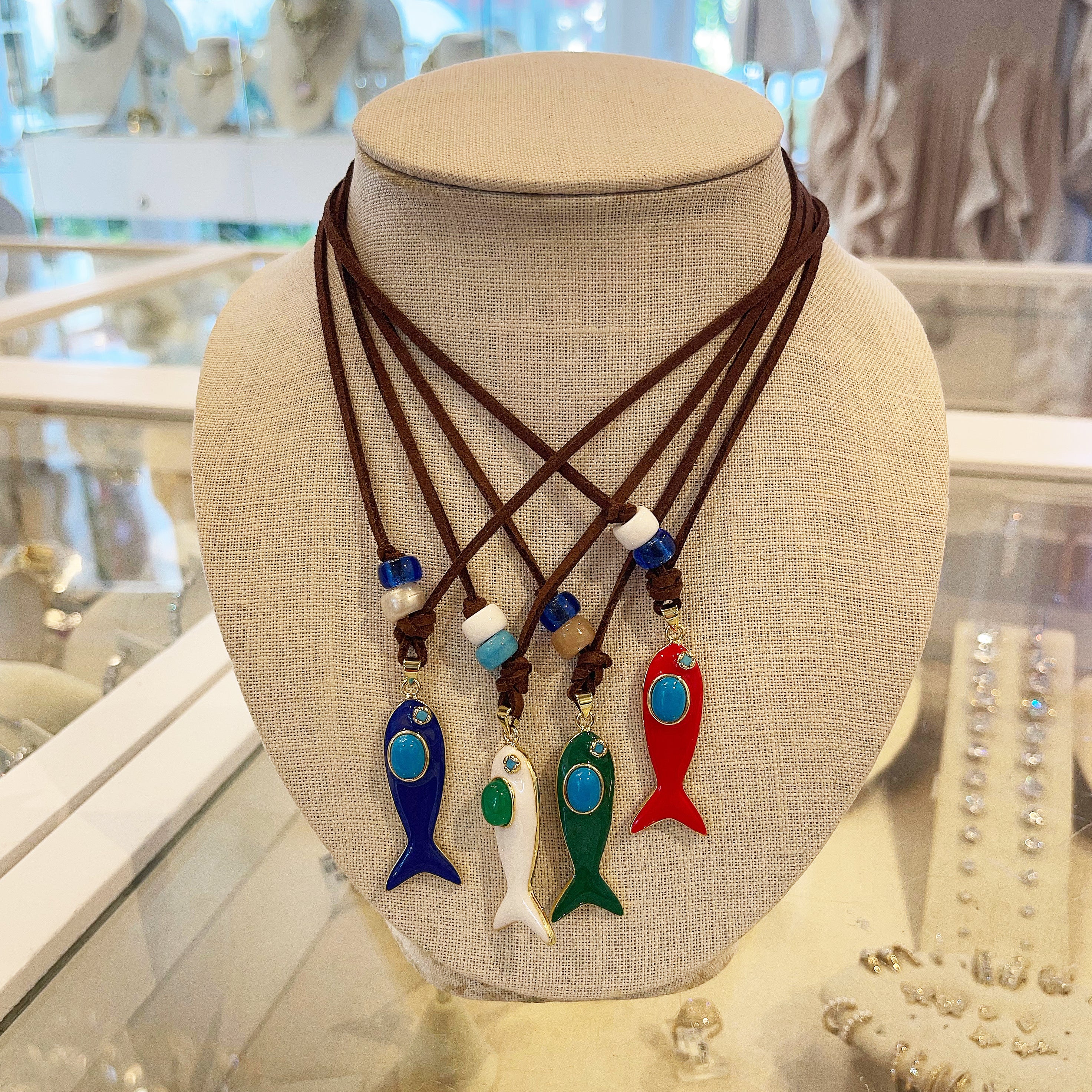 Resin Fish Pendant On Suede Leather Cord Necklace
This Fish Pendant Necklace is available in multiple color options, adding subtle yet eye-catching variety to your necklace collection. Perfect for layering, it complements diverse styles while being a chic statement.
Yellow Gold Filled
Fish Pendant: 1.5" Long X 0.5" Wide
Drop: 1.75" Long