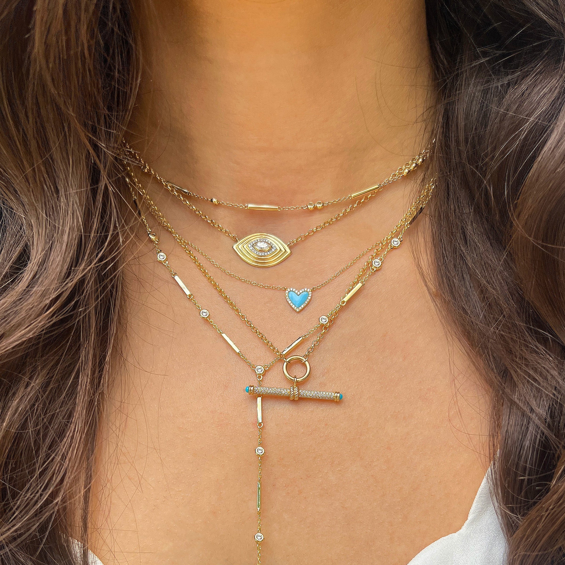 Diamond & Turquoise Toggle Necklace
This Diamond & Turquoise Toggle Necklace makes a bold statement with its textured surface and intricate detailing. Expertly crafted with diamonds that sparkle with every movement and turquoise for that pop of color!
14K Yellow Gold
0.21 Diamond Carat Weight
Toggle: 0.56" Long X 1.18" Wide
16-18" Adjustable Length