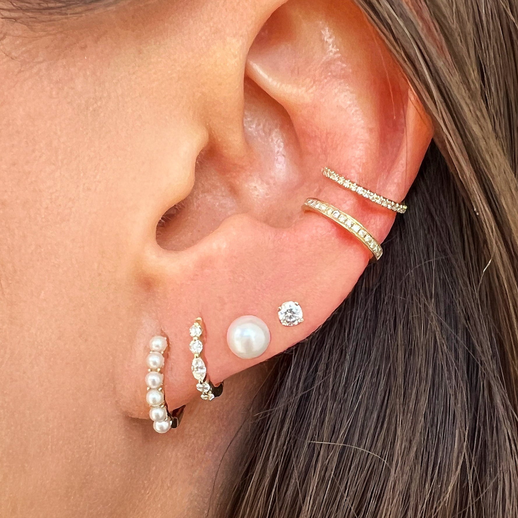 Pearl Huggie Pierced Earrings
Introducing our Pearl Huggie Earrings, the perfect combination of elegance and simplicity. These exquisite earrings feature lustrous pearls, delicately embraced by the huggie hoop design. Elevate any look with the timeless beauty of pearls, secured comfortably close to your ear.
14K Yellow Gold
0.47" Long X 0.08" Wide