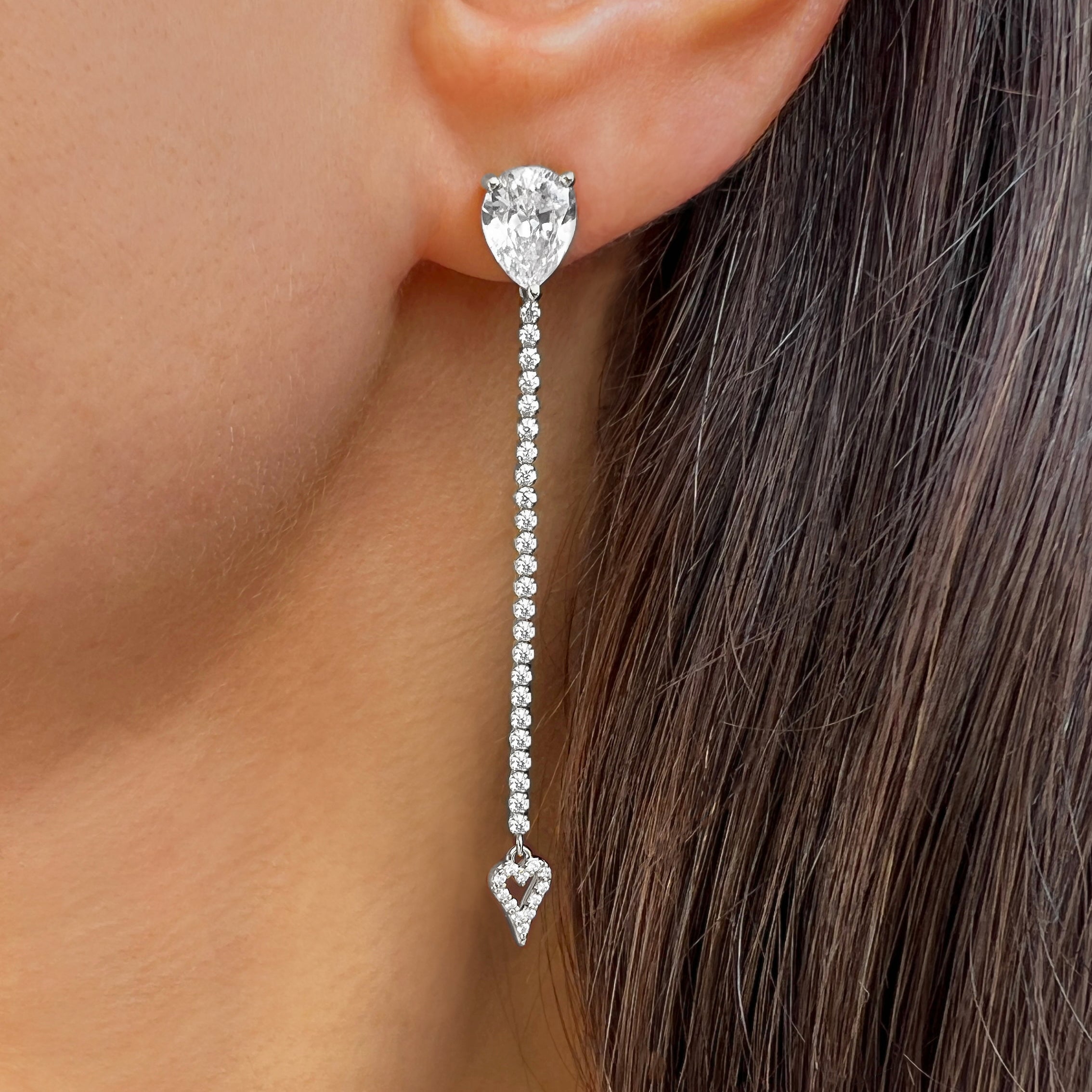 Cubic Zirconia Drop Earring worn on an ear.