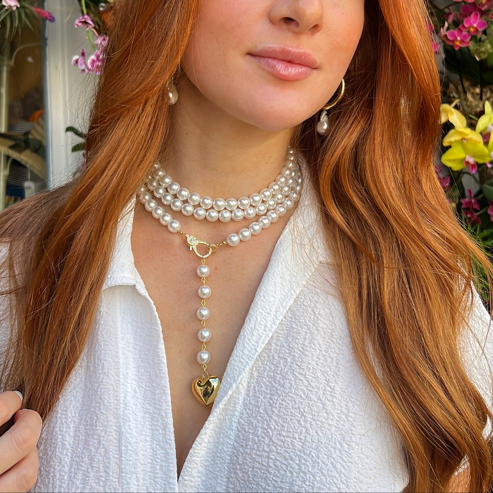 Pearl Strand Heart Drop Necklace
Yellow Gold Plated
Pearls: 0.40" Wide
Heart Pendant: 0.90" Long X 1.00" Wide
41.5" Adjustable Length