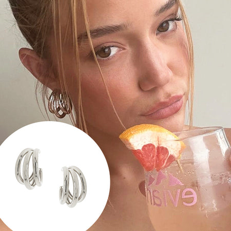 White Gold Plated Triple Hoop Pierced Earring  White Gold Plated 1.30" Diameter 0.15" Thick As worn by Olivia Ponton.