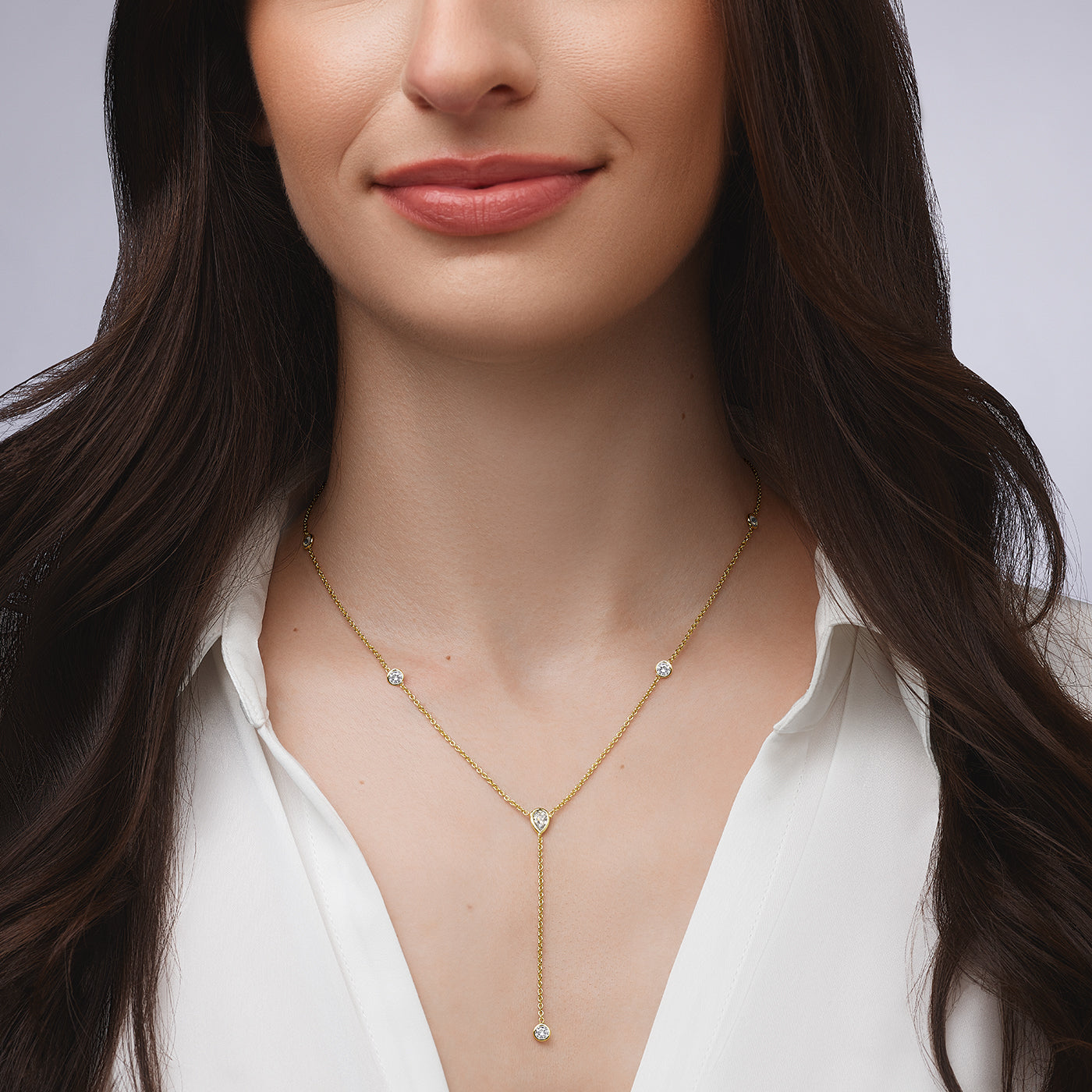 Bezel Set Lariat Necklace 14K Yellow or White Gold Plated Can be worn 17 to 21 inches, Adjustable Round CZs approximately 0.15 ct each Center Pear CZ approximately 0.35 ct Lariat drop is 2 inches long