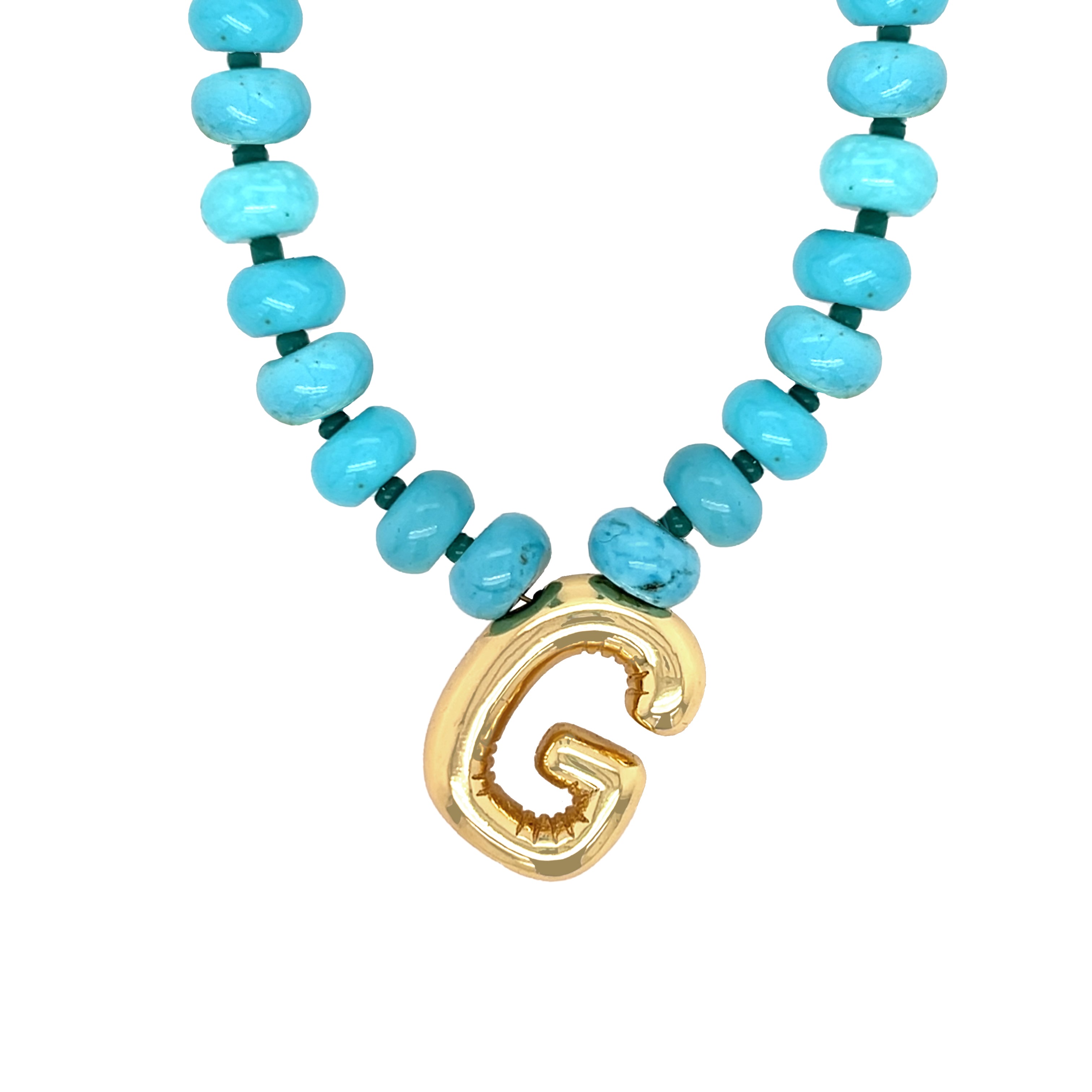 Necklace with turquoise beads and a gold letter 'G' pendant on a white background