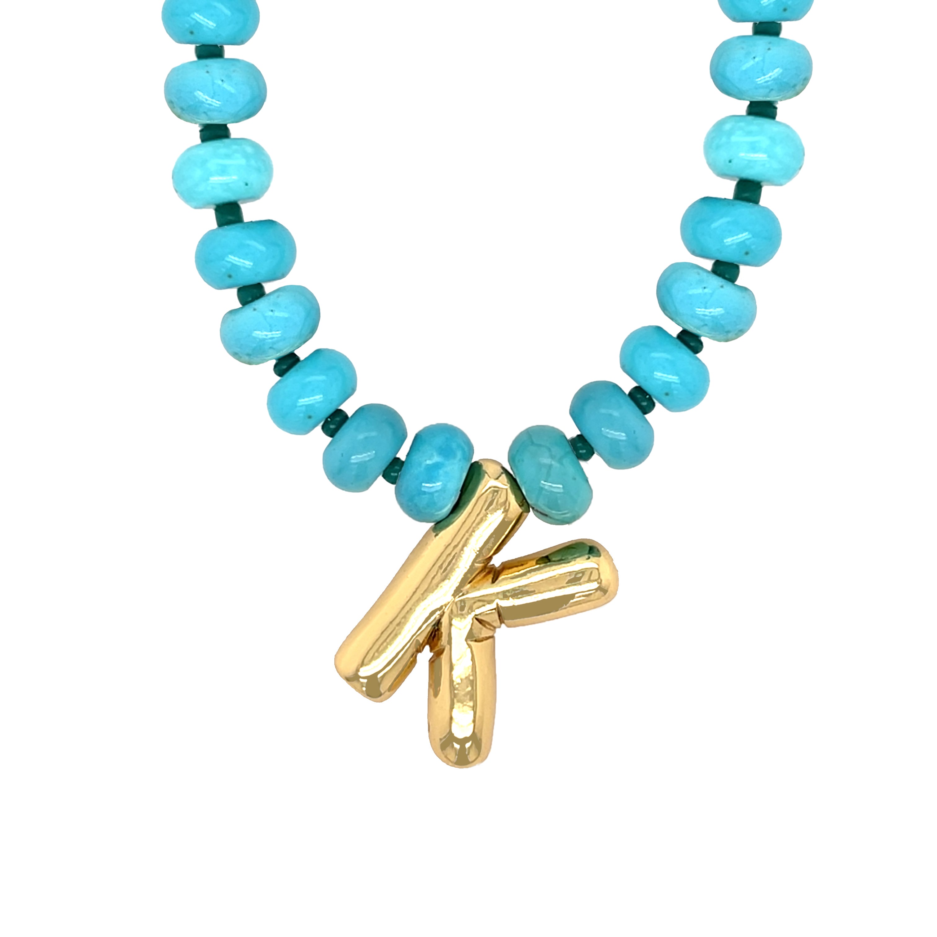 Necklace with turquoise beads and a gold clasp on a white background