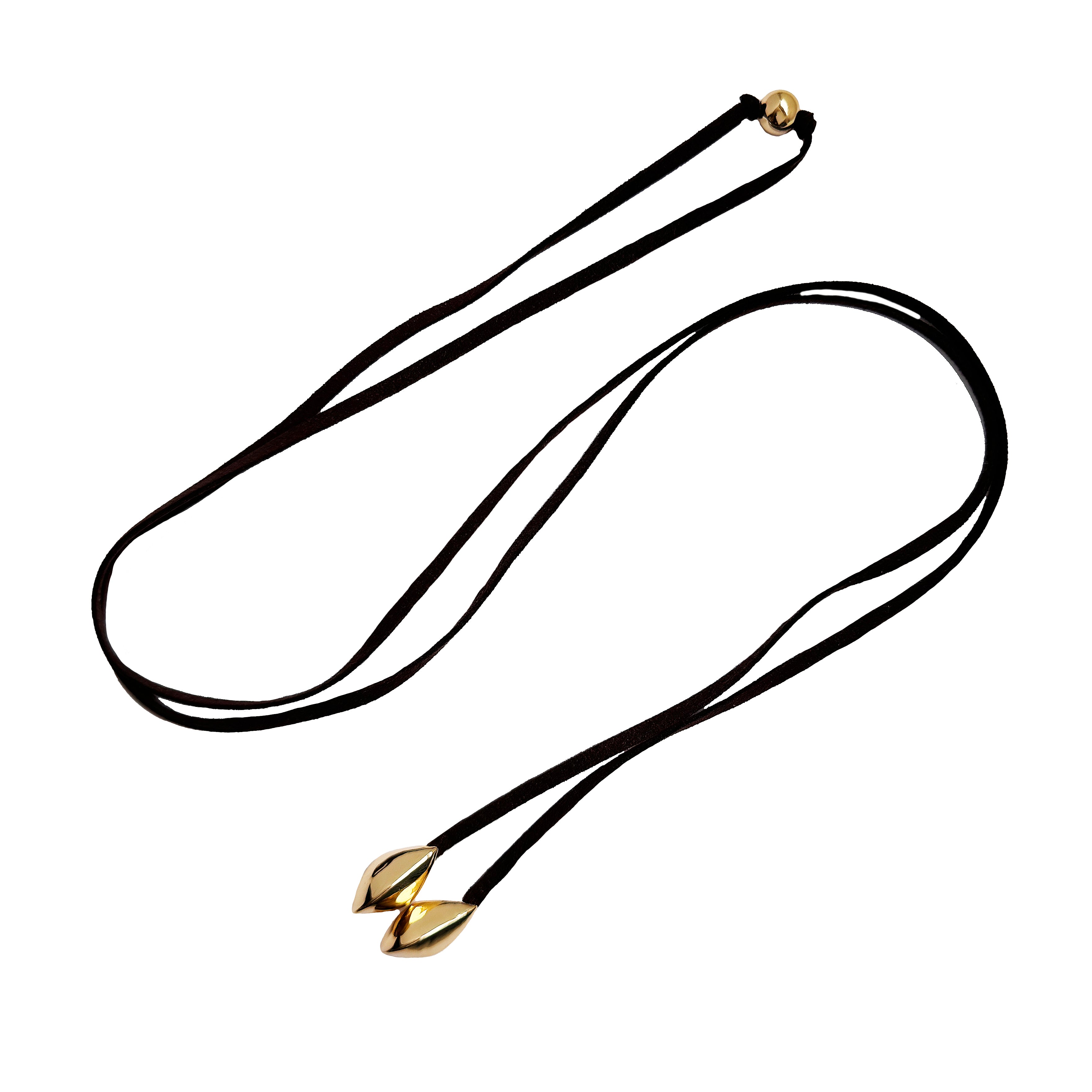 Brown Suede Lariat Necklace
This suede lariat necklace is a unique addition to any jewelry collection. The soft suede material adds a touch of luxury, while the lariat style allows for versatile wear. Elevate any outfit with this one-of-a-kind piece.
Yellow Gold Plated
Domes: 1" Long X 0.50" Wide
56" Length