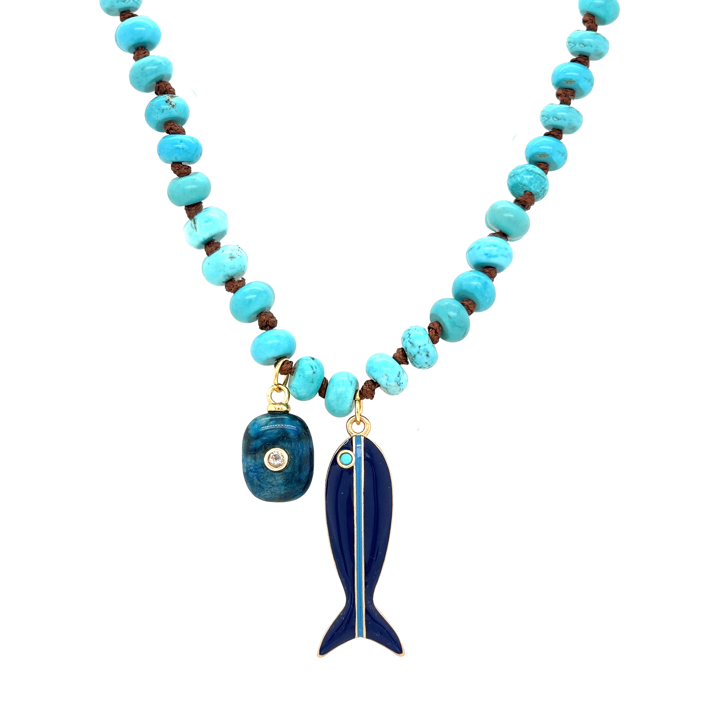 Enamel Fish and Natural Stone Charm Turquoise Bead Necklace
This playful, elevated necklace features turquoise beads with natural stones and unique charms, including a bold enamel fish and a polished stone accent. Finished in yellow gold plating, it adds color, texture, and personality to any look.
Yellow gold plated
Fish charm: 1.80" L x 0.55" W
Stone charm: 1" L x 0.50" W
Adjustable length: 16"–18"