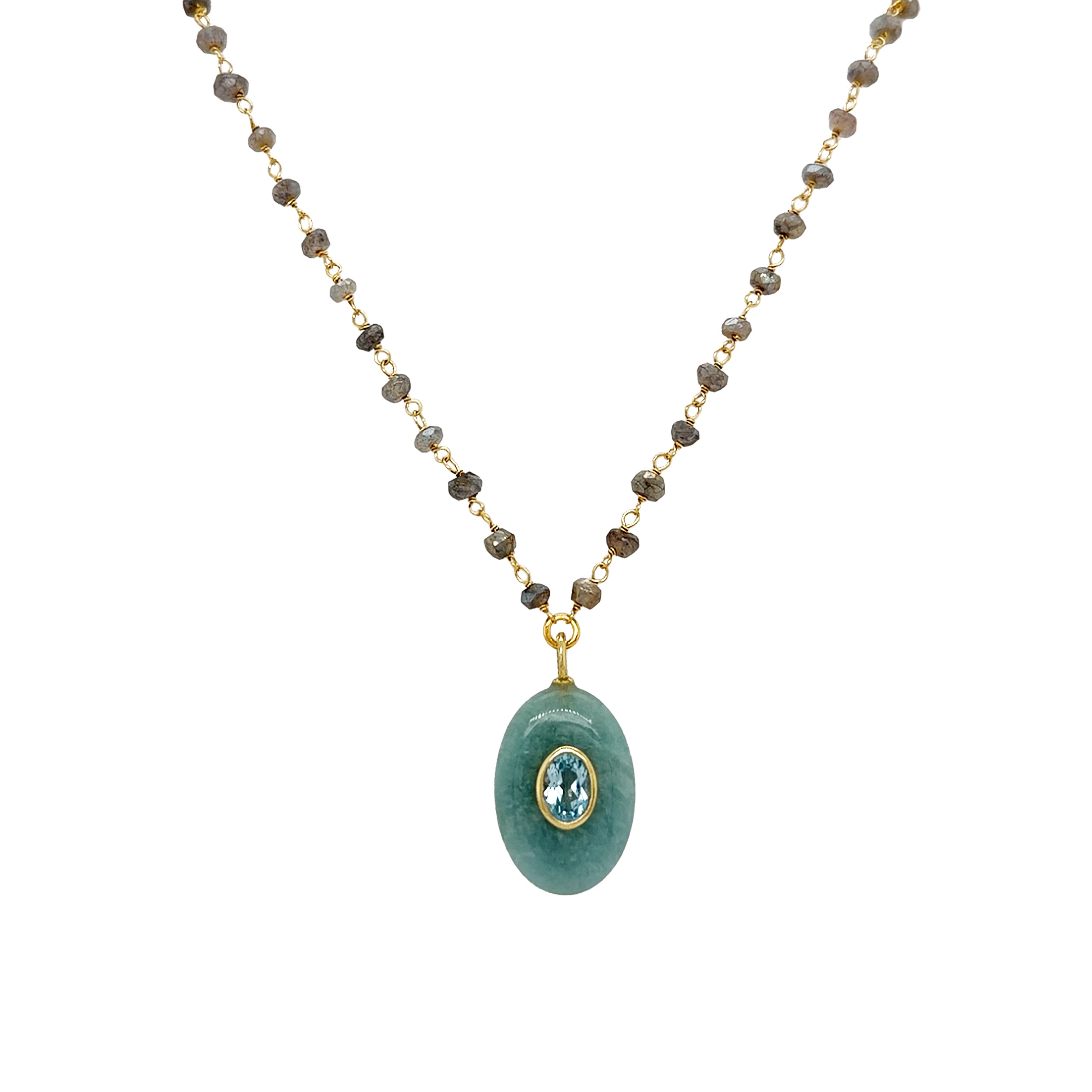 Aquamarine Oval Pendant, Blue Topaz Bezel, & Labradorite Wire Chain Necklace
Curated for the jewelry lover who craves texture. This artisanal piece brings together a triad of powerful stones: the tranquil blue of Aquamarine, the sharp clarity of Blue Topaz, and the moody, iridescent depth of Labradorite beads. Wear it to add a sophisticated pop of color to a neutral knit, or layer it with shorter gold chains for a high-impact, tiered look.
Yellow Gold Plated
1.08" Long X 0.60" Wide
16-18" Adjustable L