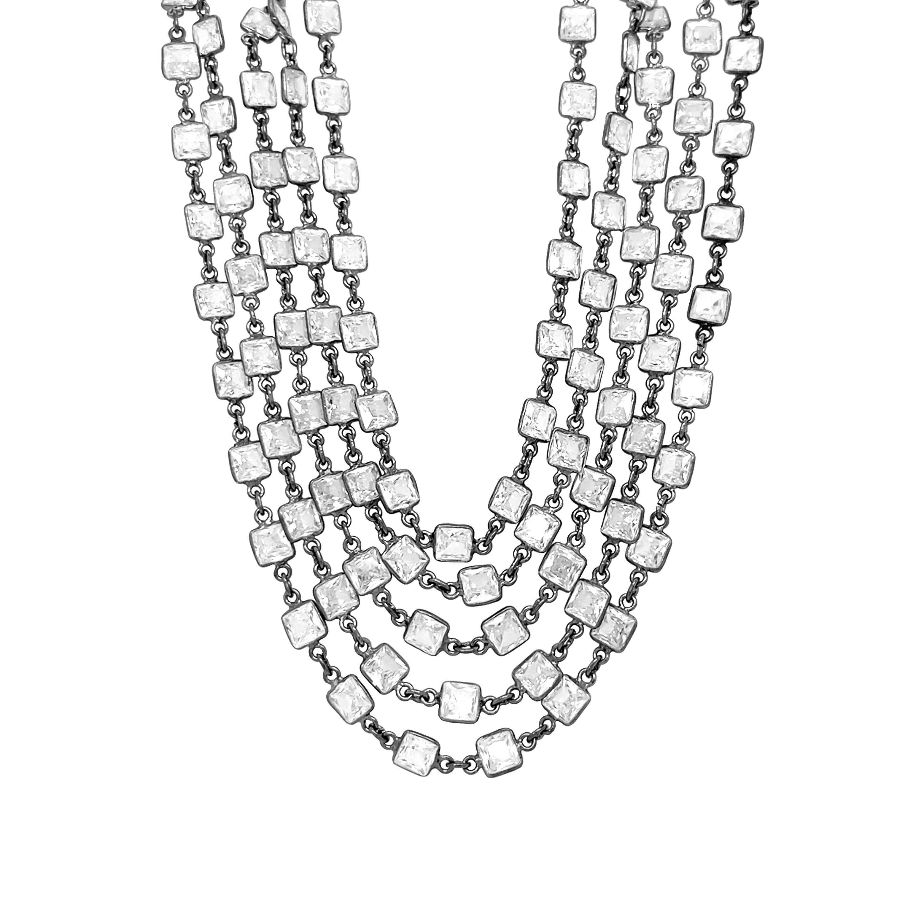 Square CZ Bezel 5-Row Necklace
Add a bold, vibrant touch to your look with our Square CZ Bezel 5-Row Necklace. Perfect for making a statement, this necklace will elevate your style game. Don't be afraid to stand out with this playful and eye-catching piece.
Oxidized Plating
16-18" Adjustable Length