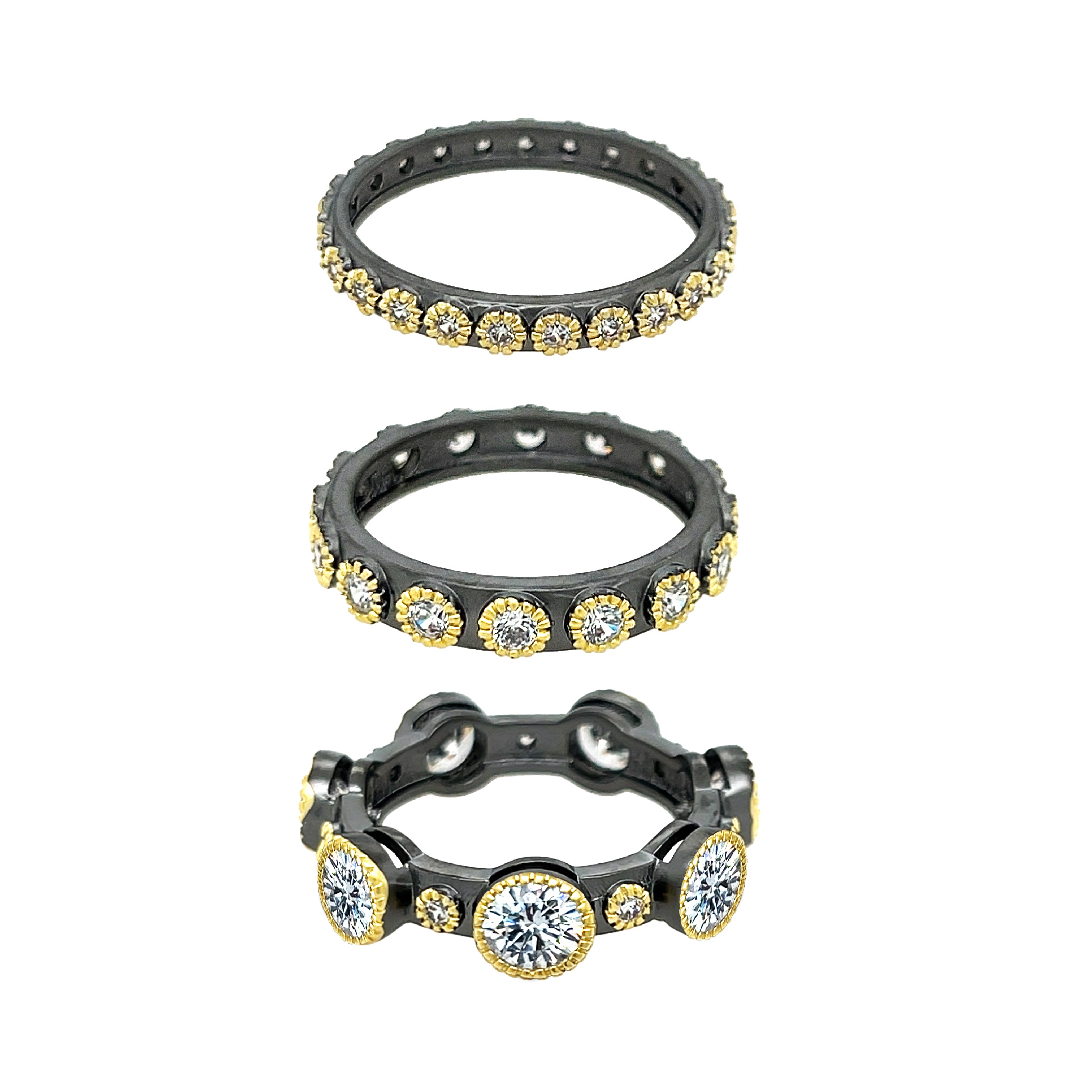 Five Band Ring Set
Bold and eye-catching, this five-band ring set features a mix of yellow and oxidized gold plating for a striking contrast. Each band is adorned with sparkling cubic zirconia, creating layers of texture and shine. Style them together or separately for a versatile, statement-making look.