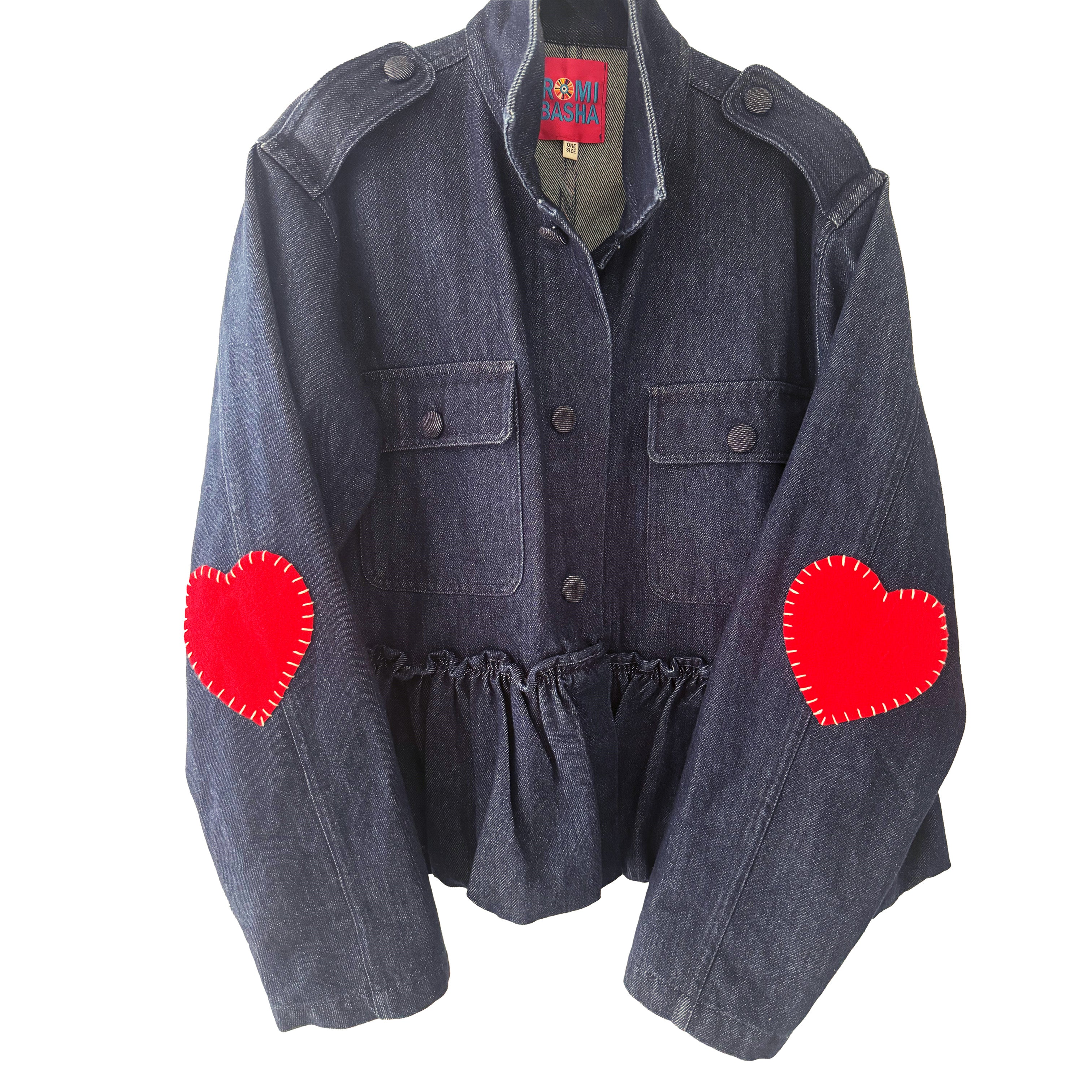 Denim Ruffled Heart Detail Jacket  Looking for a denim jacket that will show off your playful side? Look no further than our Denim Ruffled Jacket! Featuring a cute heart detail, this statement jacket is the perfect addition to any outfit.   Red Hearts On Elbows One Size   Designed by Romi Basha.  Due to popular demand, please allow 2-3 weeks for delivery.