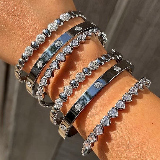 Crystal Eternity Bangle Bracelet White Gold Plated Over Stainless Steel Oval Shape: 1.95" X 2.35" 0.24" Width Hinge Closure While supplies last. All Deals Of The Day sales are FINAL SALE.