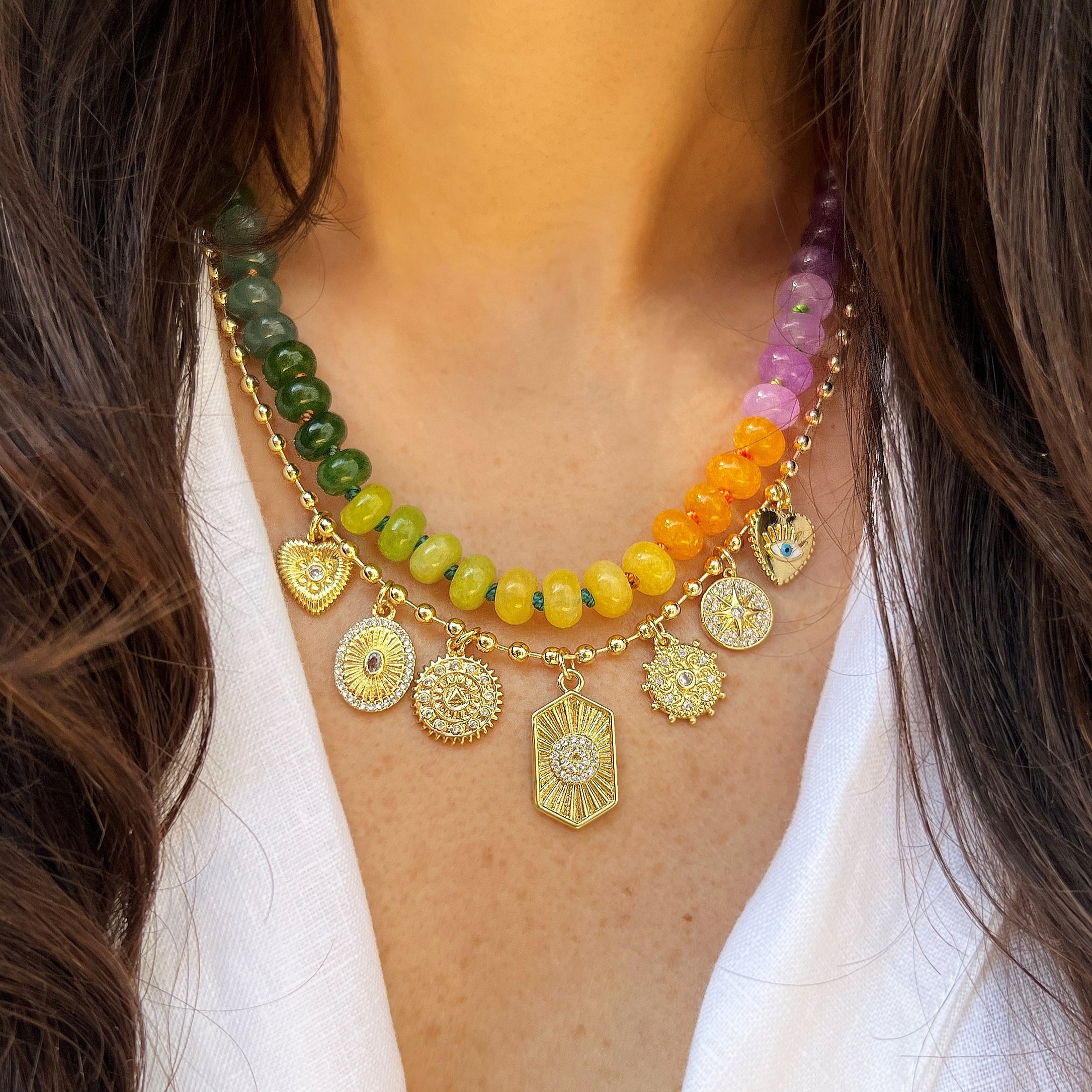 Rainbow Bead Necklace With Charm Holder
Colorful beaded charm necklace plated in yellow gold and featuring vibrant rainbow beads. Designed with a removable charm holder, allowing you to personalize the look by adding or swapping charms. Playful yet polished, this necklace is perfect for layering or wearing solo.
Yellow Gold Plated
Beads: 8MM
