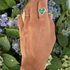 Malachite + diamond heart ring worn with large pave heart ring