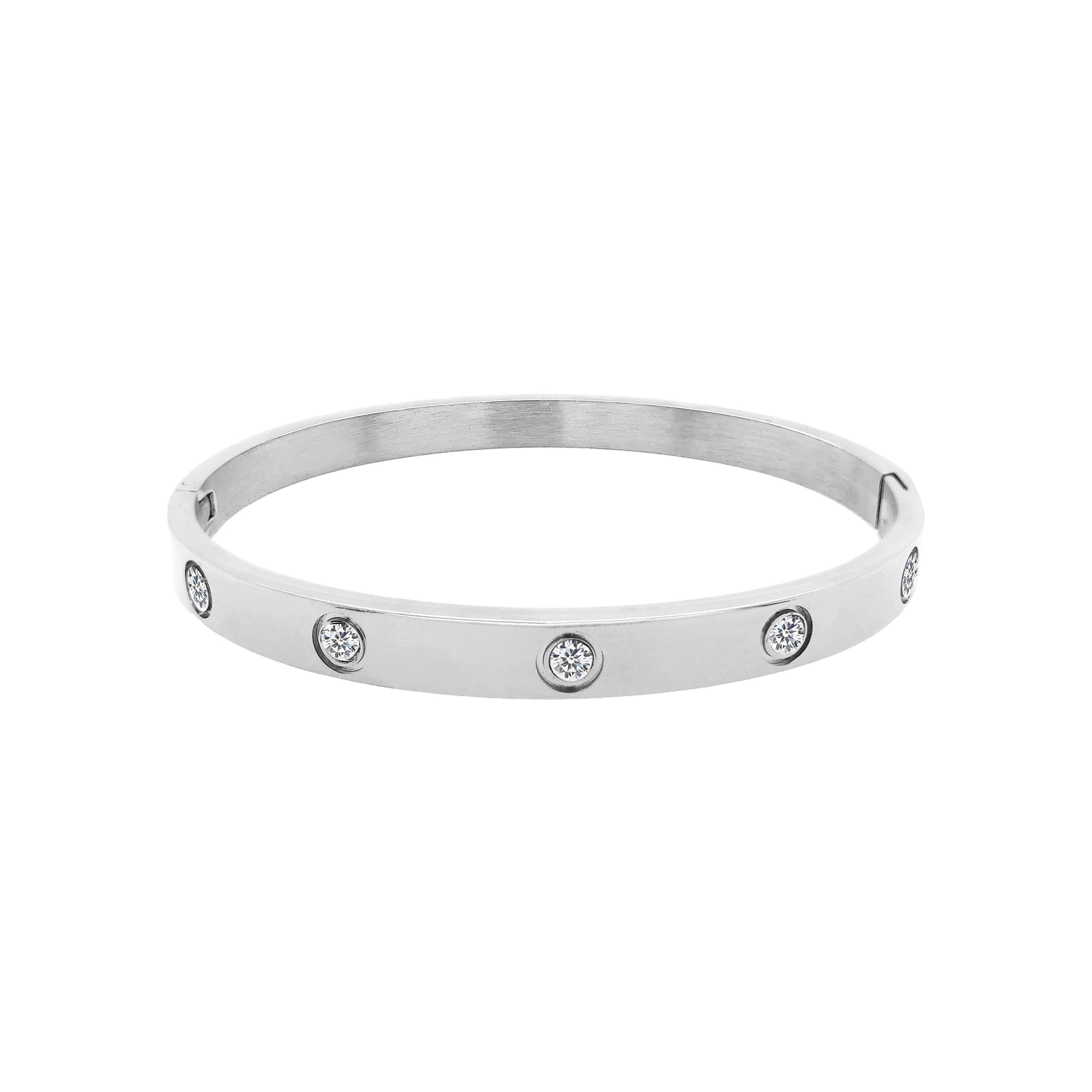 Crystal Eternity Bangle Bracelet  White Gold Plated Over Stainless Steel Cubic Zirconia Oval Shape: 1.95" X 2.35" 0.24" Width Hinge Closure