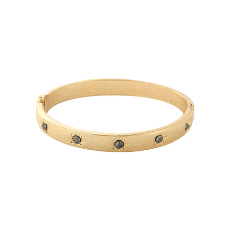 Gray Stone Starburst Etched Bangle Bracelet  Yellow Gold Plated Cubic Zirconia Oval Shape: 2.29” X 2.00” 0.25” Width Hinge Closure