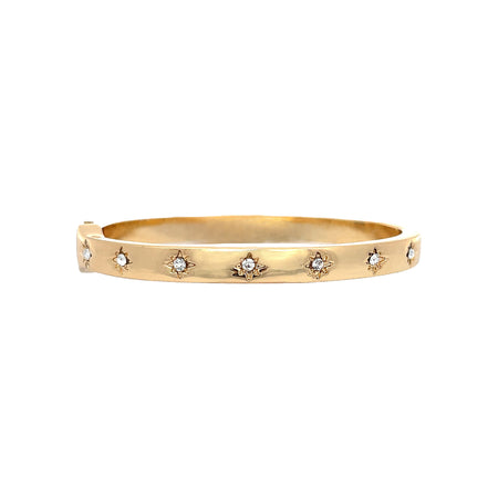 Clear Stone Starburst Etched Bangle Bracelet  Yellow Gold Plated Cubic Zirconia Oval Shape: 2.40" Long X 2.00" Wide 0.20" Thick Hinge Closure