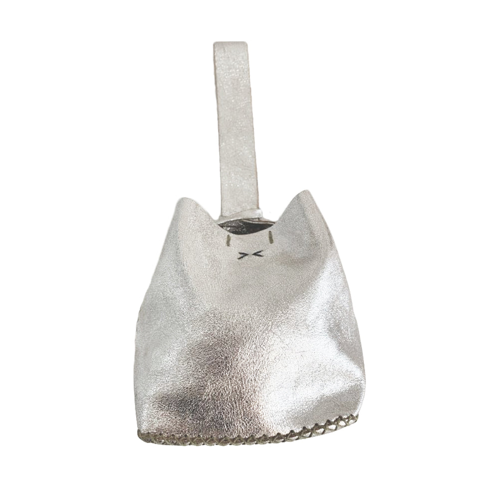 A silver leather mini bucket bag with a sleek design and a small branding tag attached to the side.