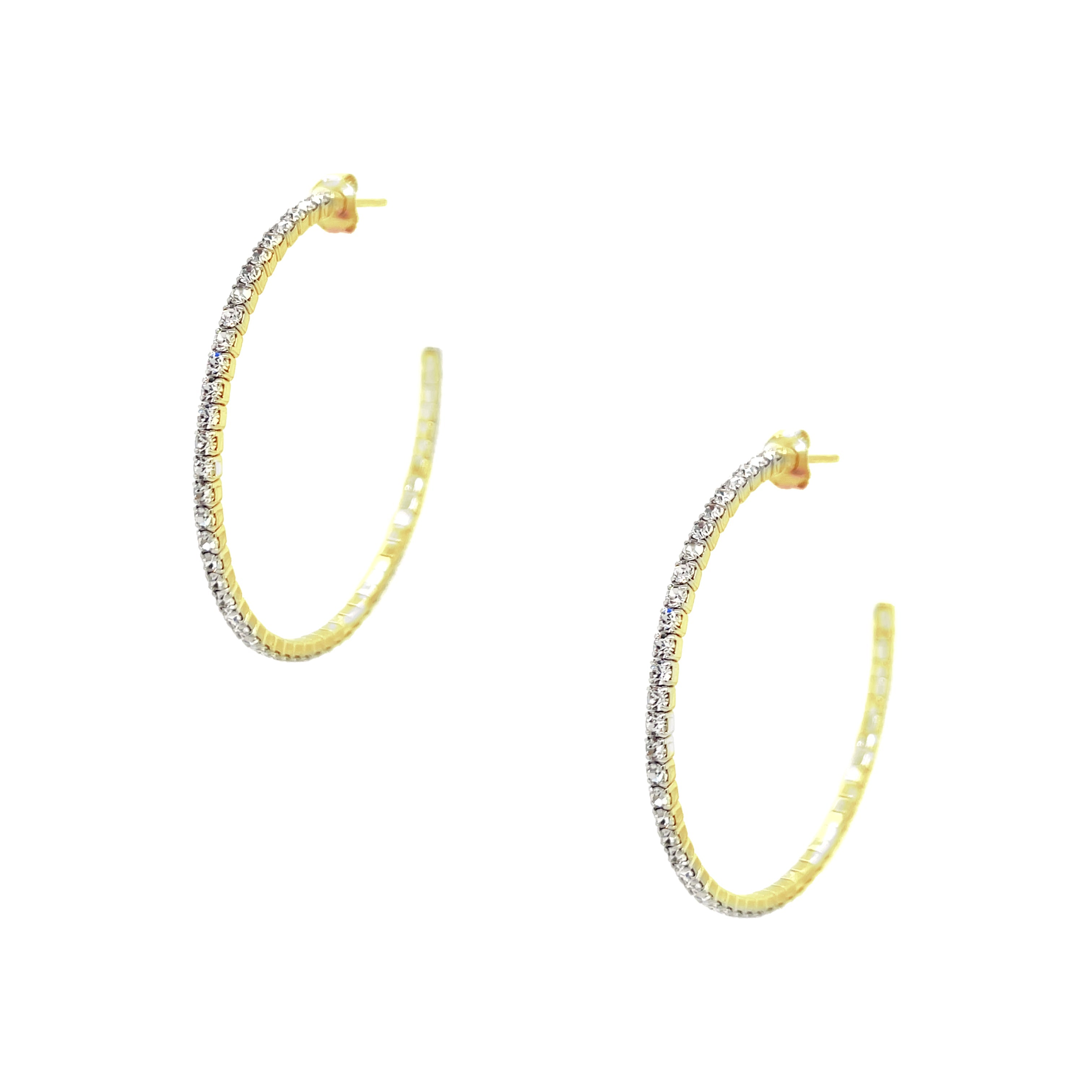 Flexible Pave Hoop Earrings Our favorite sparkly hoop earrings! The best part? They are flexible and lightweight, easy to wear all day long and into the night. • Yellow Gold Plated • Pave set Cubic Zirconia • 1.5" Diameter