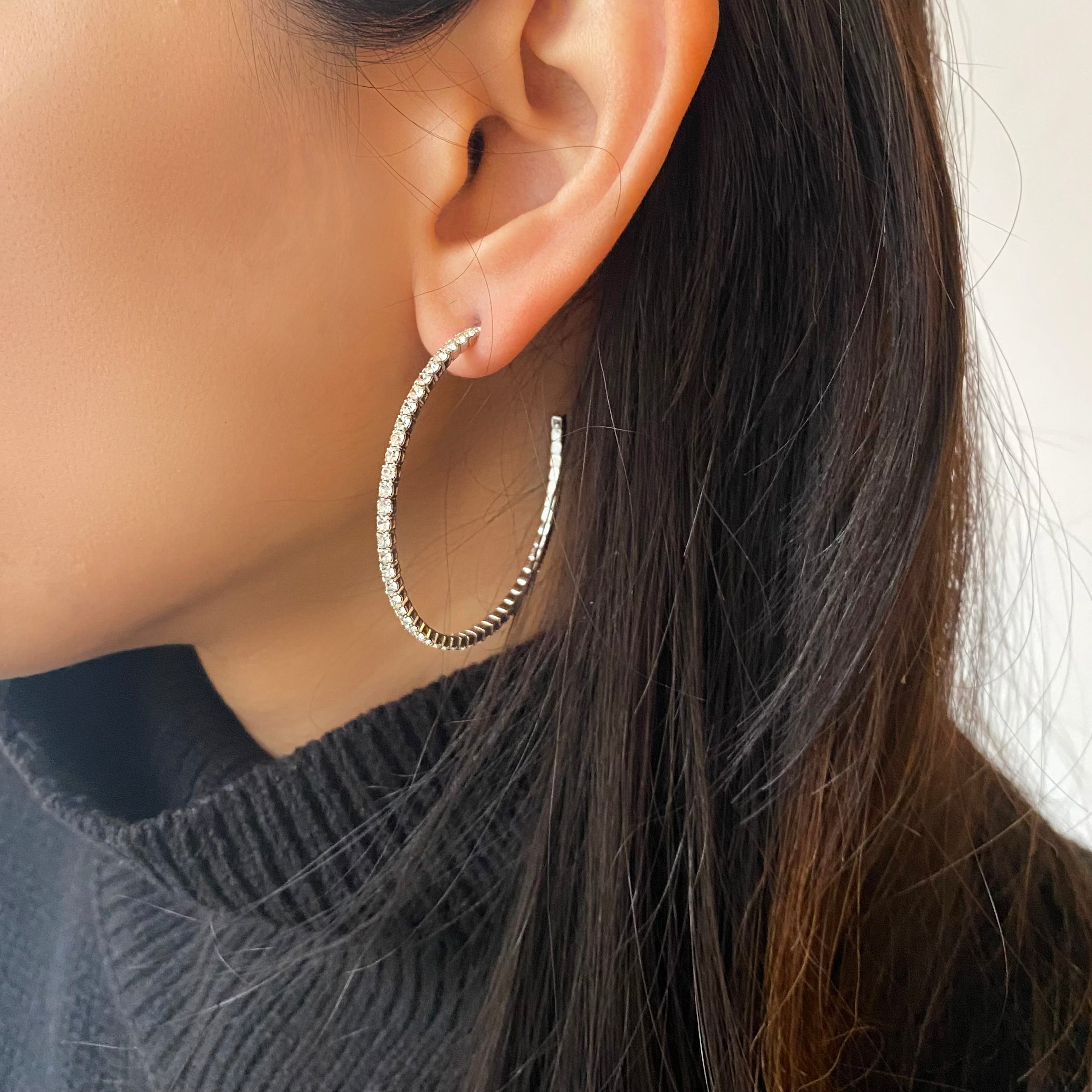 Flexible Pave Hoop Earrings Our favorite sparkly hoop earrings! The best part? They are flexible and lightweight, easy to wear all day long and into the night. • Yellow Gold Plated • Pave set Cubic Zirconia • 1.5" Diameter