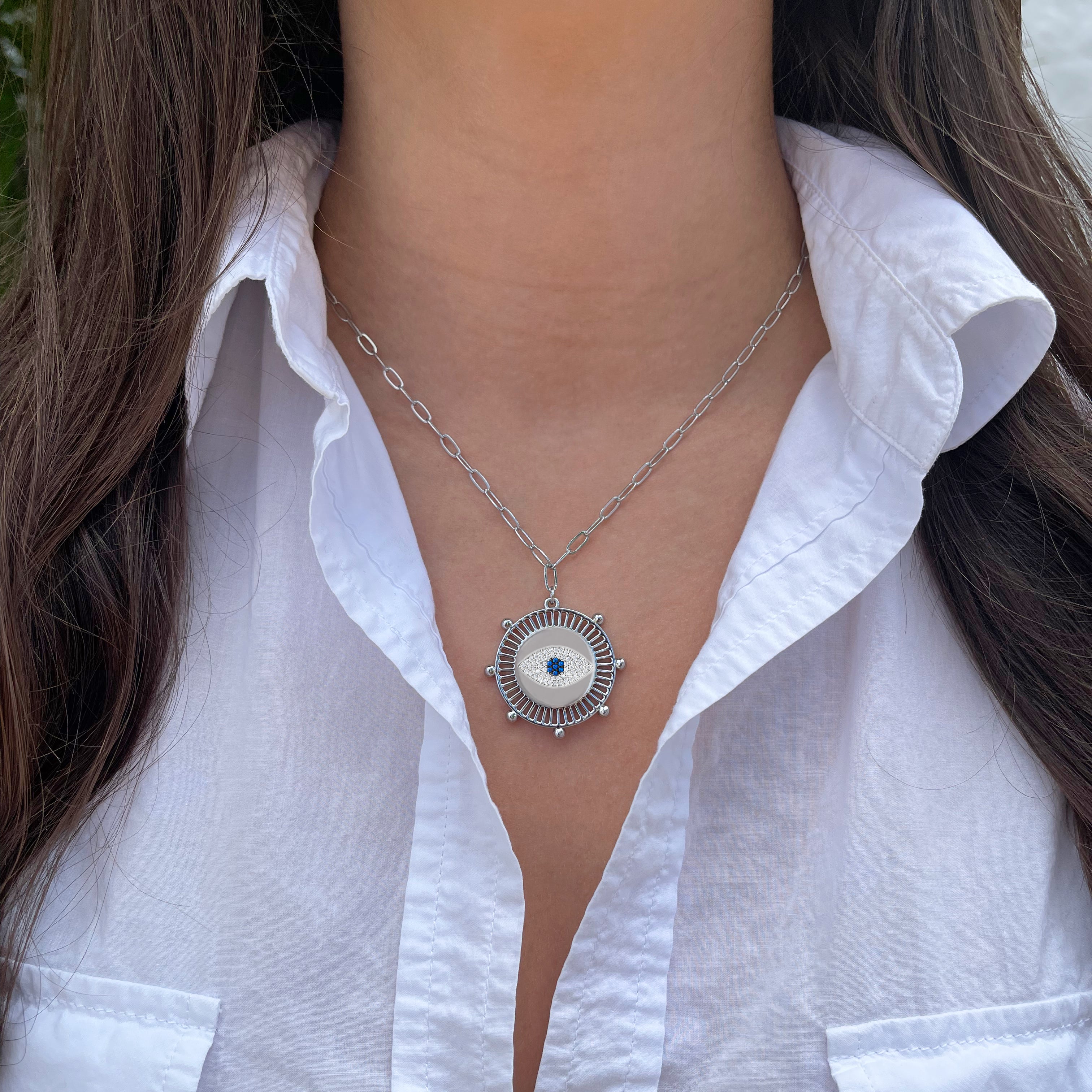 White Gold Plated Pave Evil Eye Medallion Necklace on Paperclip Chain White Gold Plated Medallion: 1" Diameter Eye: 0.6" Diameter Chain: 16-20" Long