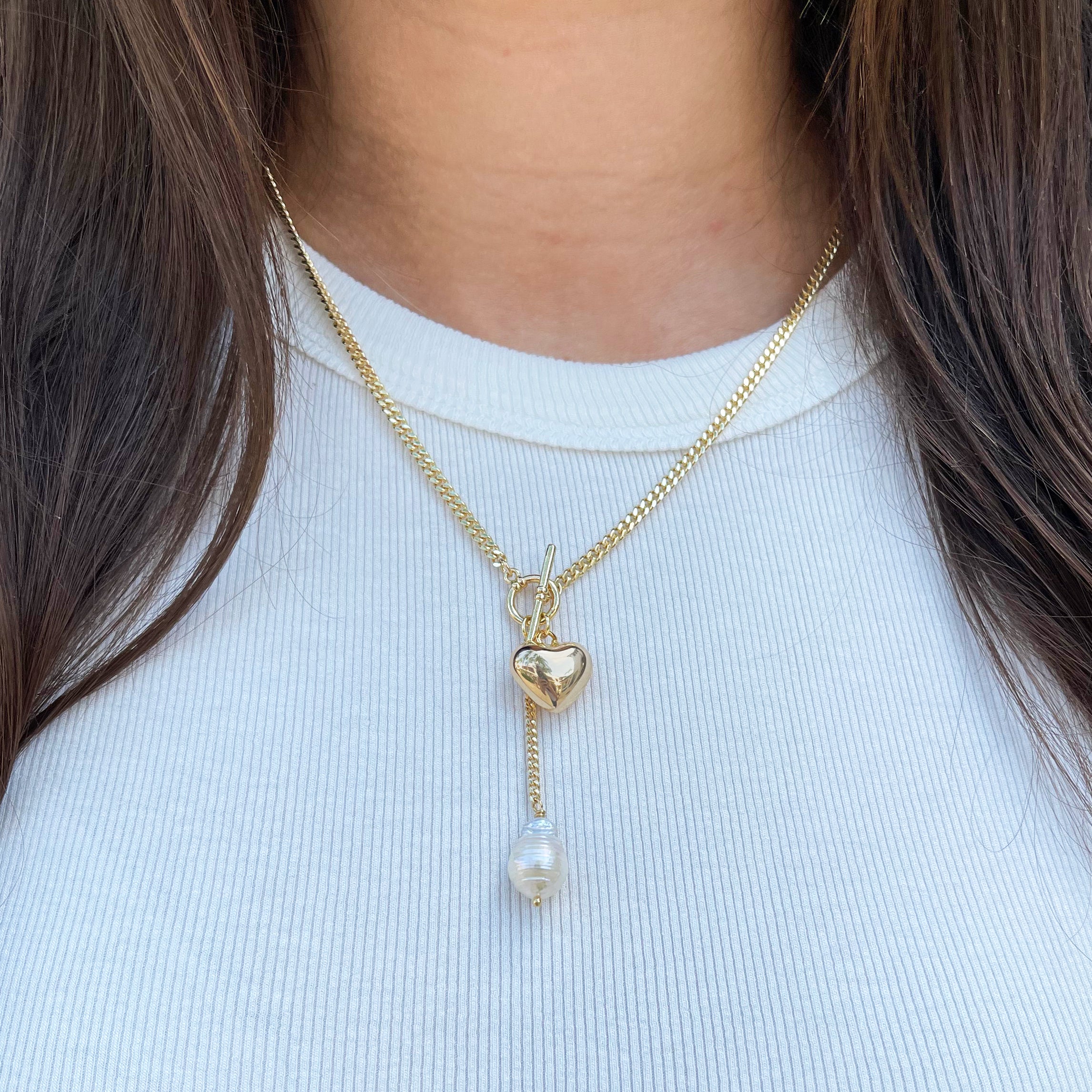 Yellow Gold Plated Heart & Pearl Toggle Necklace Yellow Gold Plated Chain: 18" Long Drop Chain: 2" Long Heart: 0.50" Long X 0.60" Wide Freshwater Pearl: 0.60" Long X 0.40" Wide