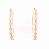 Pave circle hoop earrings rotating against a white background