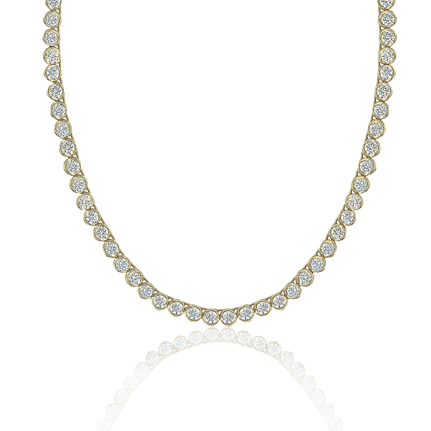 A yellow gold tennis necklace featuring a continuous row of round-cut clear gemstones, displayed against a clean white background with a soft reflection below.