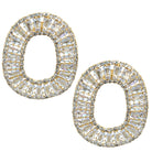 Gold and clear crystal earrings on a white background