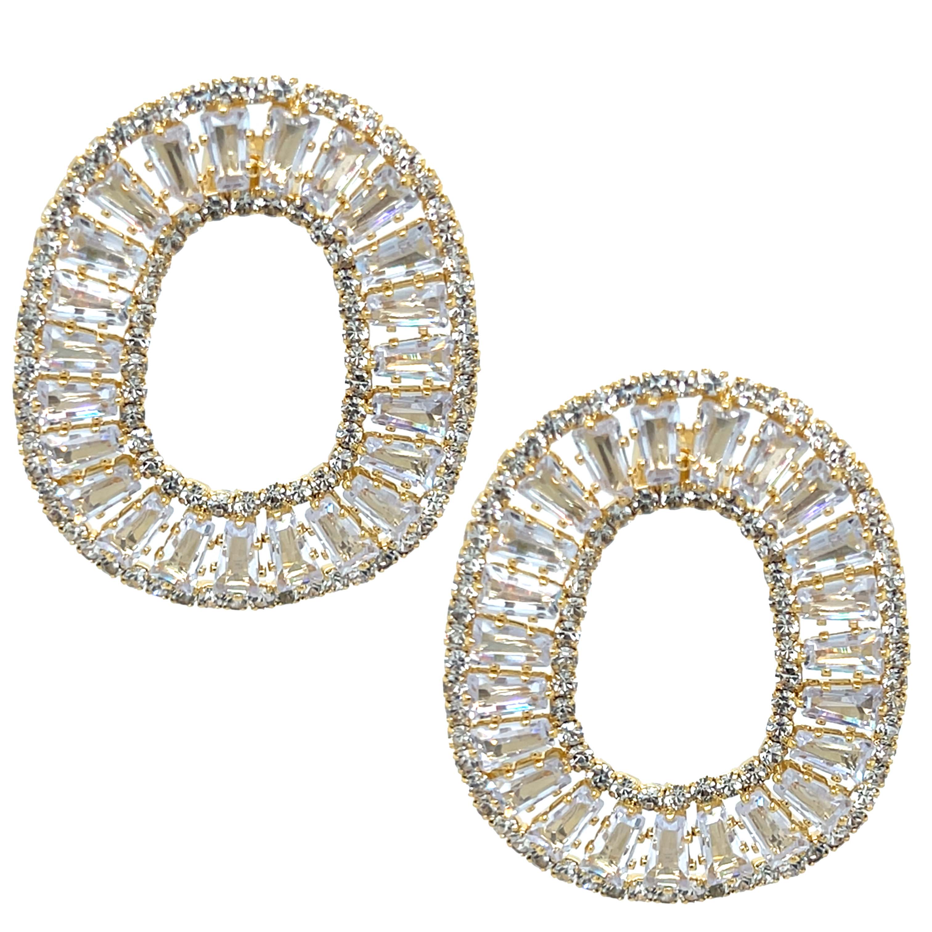 Gold and clear crystal earrings on a white background