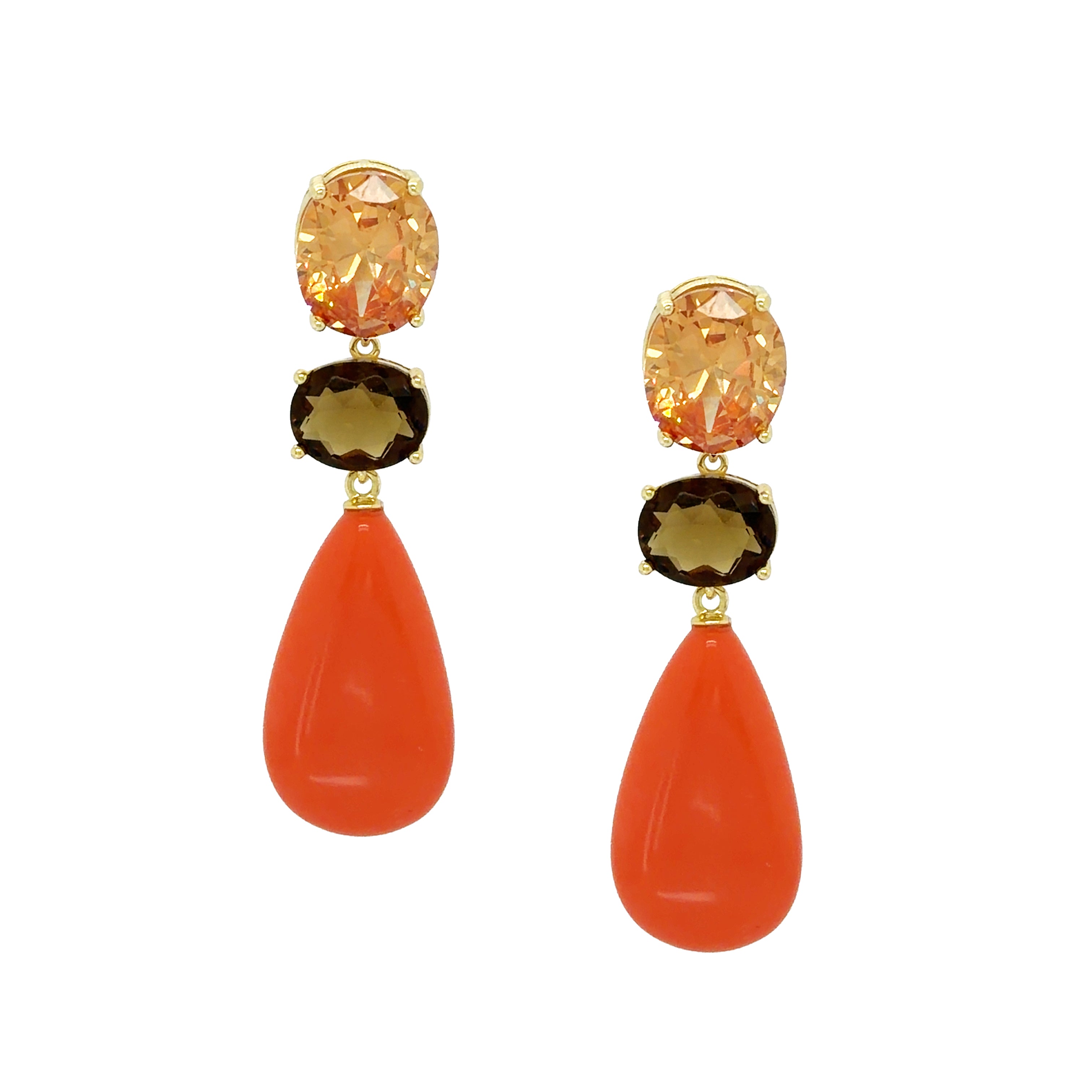 Pair of earrings with orange teardrop stones and gold accents on a white background