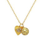 Gold necklace with heart-shaped pendant and spherical ball pendant on a white background