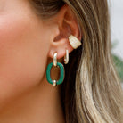 Green Crystal Open Oval Earrings

These open oval earrings add just the right statement to your look. A fresh pop of green with a modern edge. Pair them with crisp whites, denim, or an all-black outfit for an instant lift. Perfect for everyday polish or a night out.

Yellow Gold Plated Over Silver
1.39" Long X 0.80" Wide
Cubic Zirconia