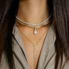 Crystal Pear Drop Choker Necklace

Yellow Gold Plated
Cubic Zirconia
Removable Charm: 1.05" Long X 0.40" Wide