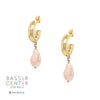 These exquisite hoops feature a stunning light pink pearl elegantly set in your choice of yellow or white gold plating, embodying the essence of elegance and hope. These gorgeous earrings perfectly complement any ensemble, making them a versatile addition to your jewelry collection. Pair them effortlessly with other jewels and stay in vogue while making a meaningful impact.   Pink Pearl Drop on Small Hoop Pieced Earrings  Yellow or White Gold Plating