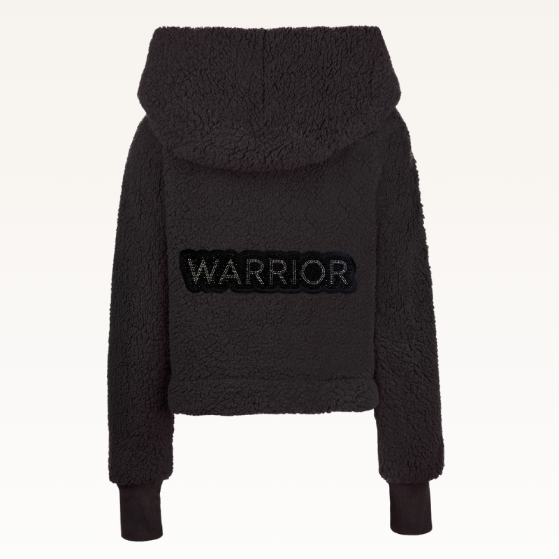 The Warrior Cropped Lounger is more than loungewear—it’s a lifestyle. I designed it in plush sherpa to be worn 24/7, 365 days a year, from couchside to courtside and everywhere in between. For me, it’s a true badge of comfort and strength—there for every moment I choose to thrive.&nbsp; Show here in Black.


Product Details &amp; Care Instructions:

Fabrication: 100% Polyester, Sherpa
Features: Sherpa, Hood, Button Front-Closure, Rib Cuffs with Thumbholes
Fit: Relaxed Fit: Generously Cut with Maximum Wearin