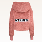 The Warrior Cropped Lounger is more than loungewear—it’s a lifestyle. I designed it in plush sherpa to be worn 24/7, 365 days a year, from couchside to courtside and everywhere in between. For me, it’s a true badge of comfort and strength—there for every moment I choose to thrive.&nbsp;Show here in Romantic Rose.


Product Details &amp; Care Instructions:

Fabrication: 100% Polyester, Sherpa
Features: Sherpa, Hood, Button Front-Closure, Rib Cuffs with Thumbholes
Fit: Relaxed Fit: Generously Cut with Maximum